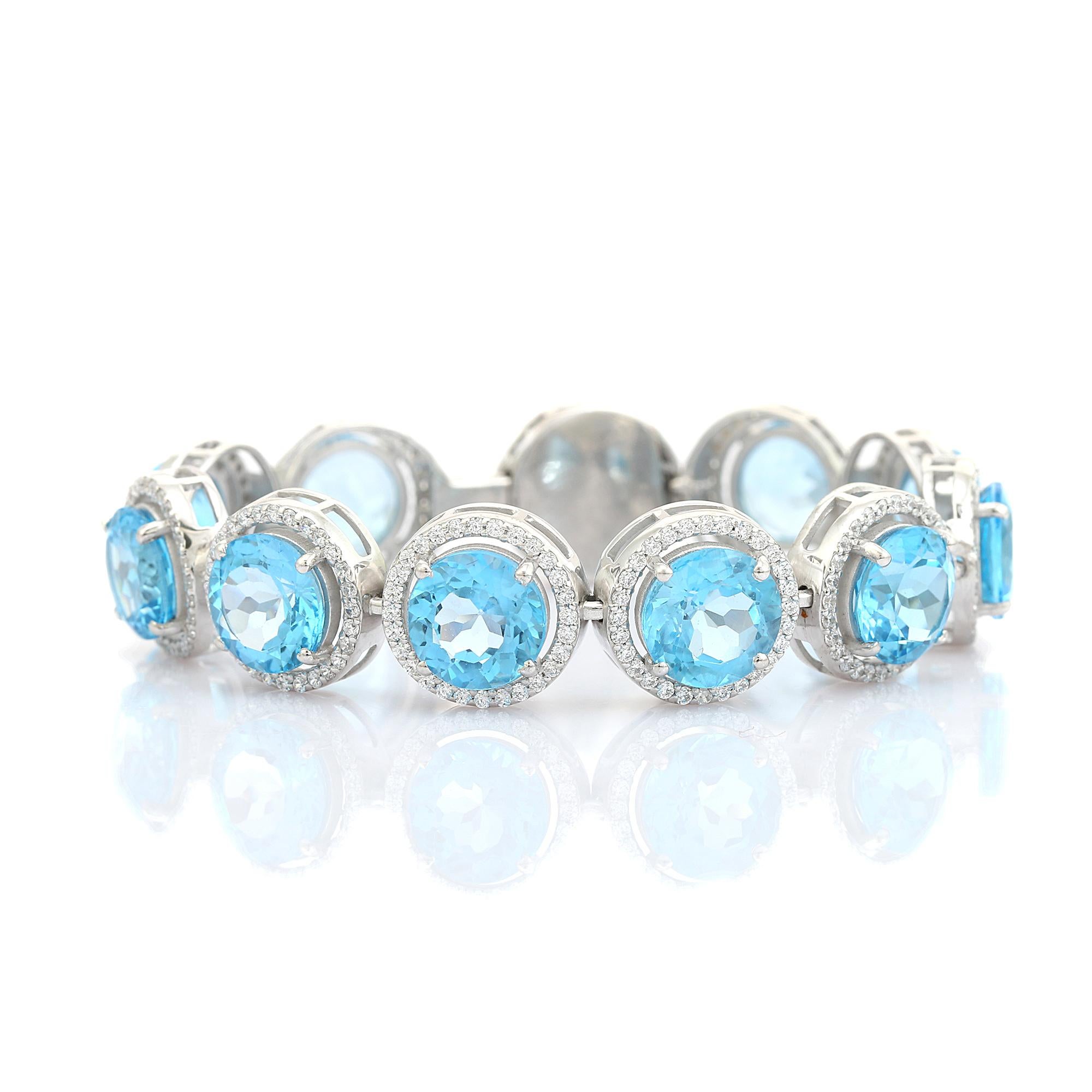 Pulsera de plata con topacio azul redondo y halo de circonitas para regalar en venta 1