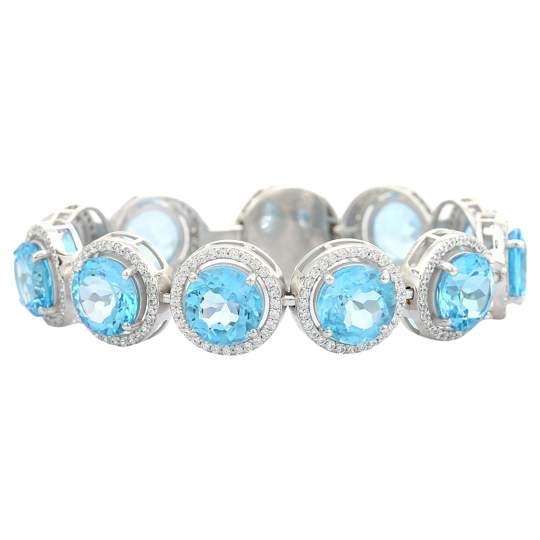 Pulsera de plata con topacio azul redondo y halo de circonitas para regalar en venta