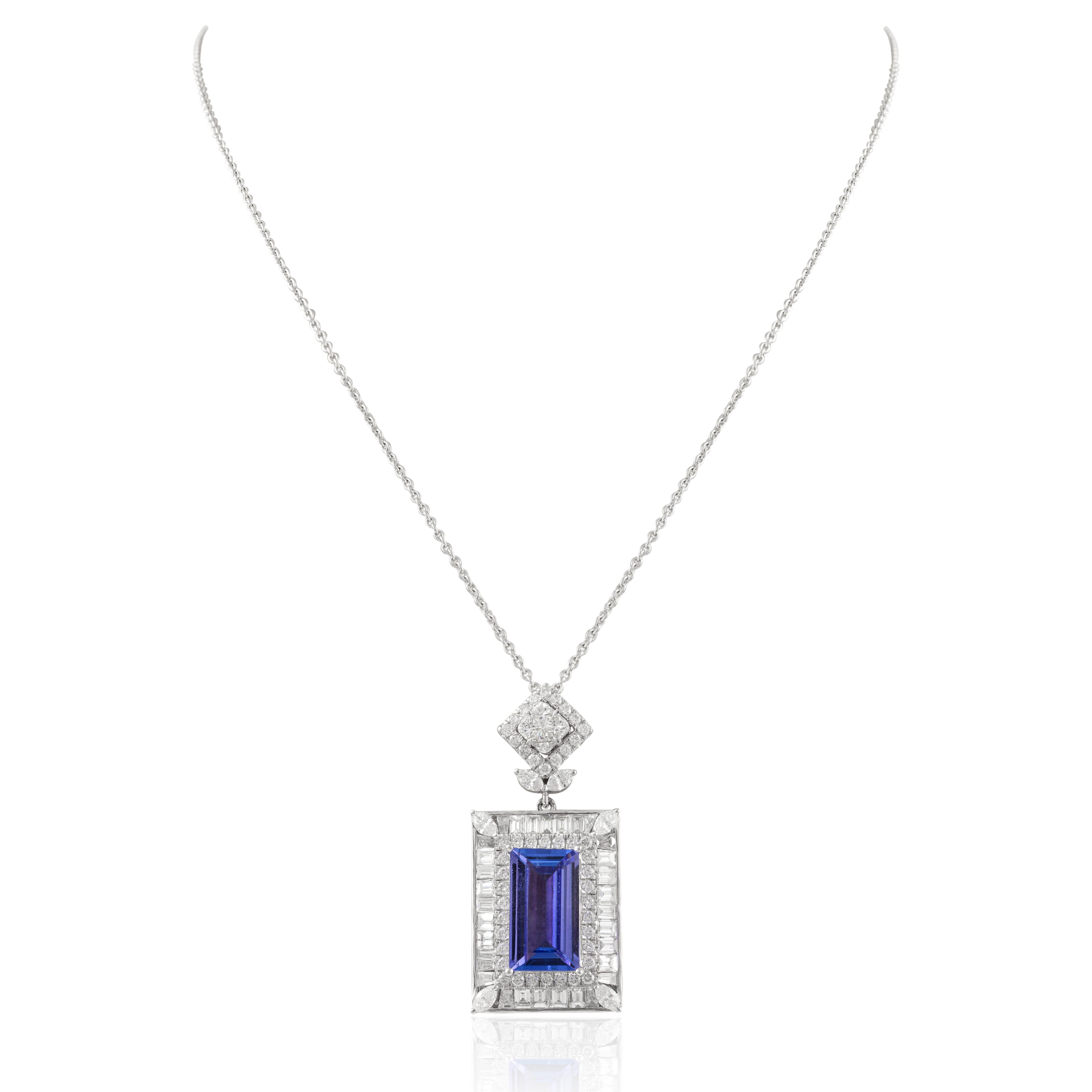 Statement Tanzanite Diamond Chain Necklace in 18K Gold studded with baguette cut tanzanite and round cut diamonds. This stunning piece of jewelry instantly elevates a casual look or dressy outfit. 
Tanzanite brings energy, calmness and happiness