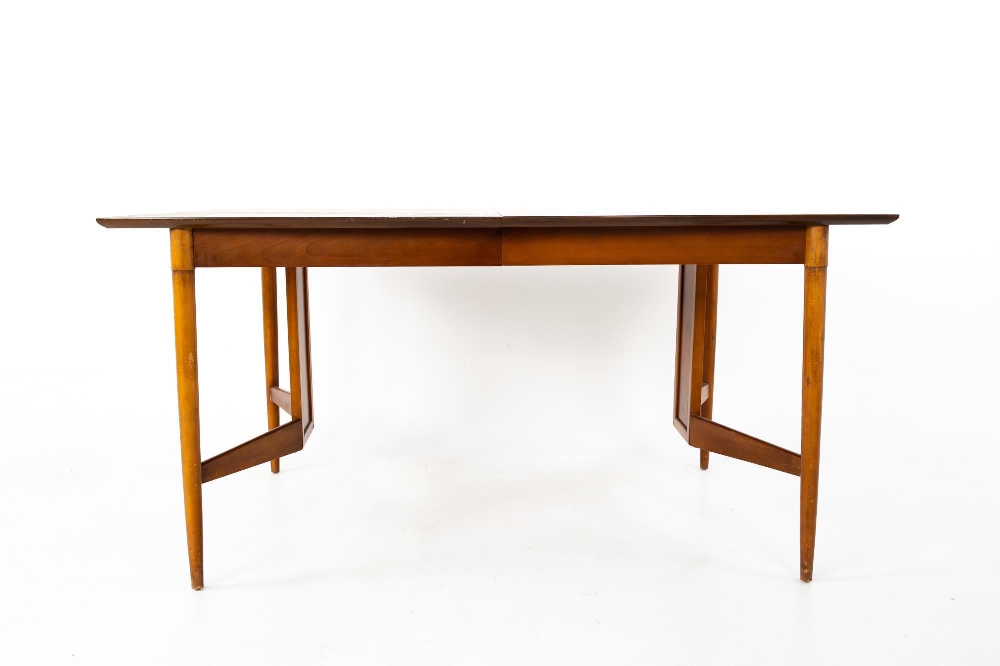 Statesville Chair Company Mid Century walnut surfboard dining table
Table measures: 60 wide x 40 deep x 29.5 inches high

This piece is available in what we call restored vintage condition. Upon purchase it is fixed so it’s free of watermarks, chips