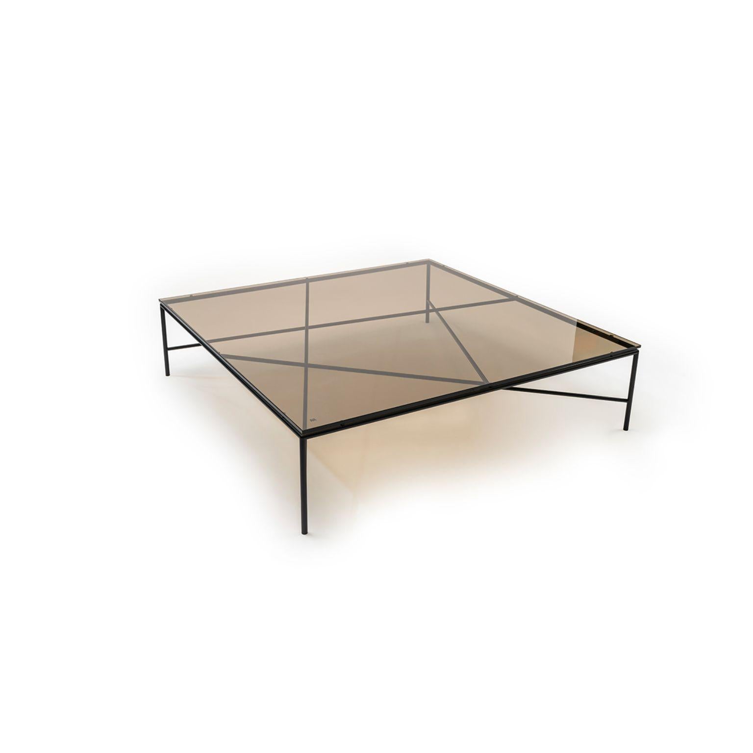 Static table by Todd Bracher
Materials: Top: Glass
 Structure: Black and Peltro powder-coated metal.
Dimensions: : Ø 120 x H 30.7cm

Static is an iconic table. Its beauty is inherently tied to its structure, which was designed as a piece
of