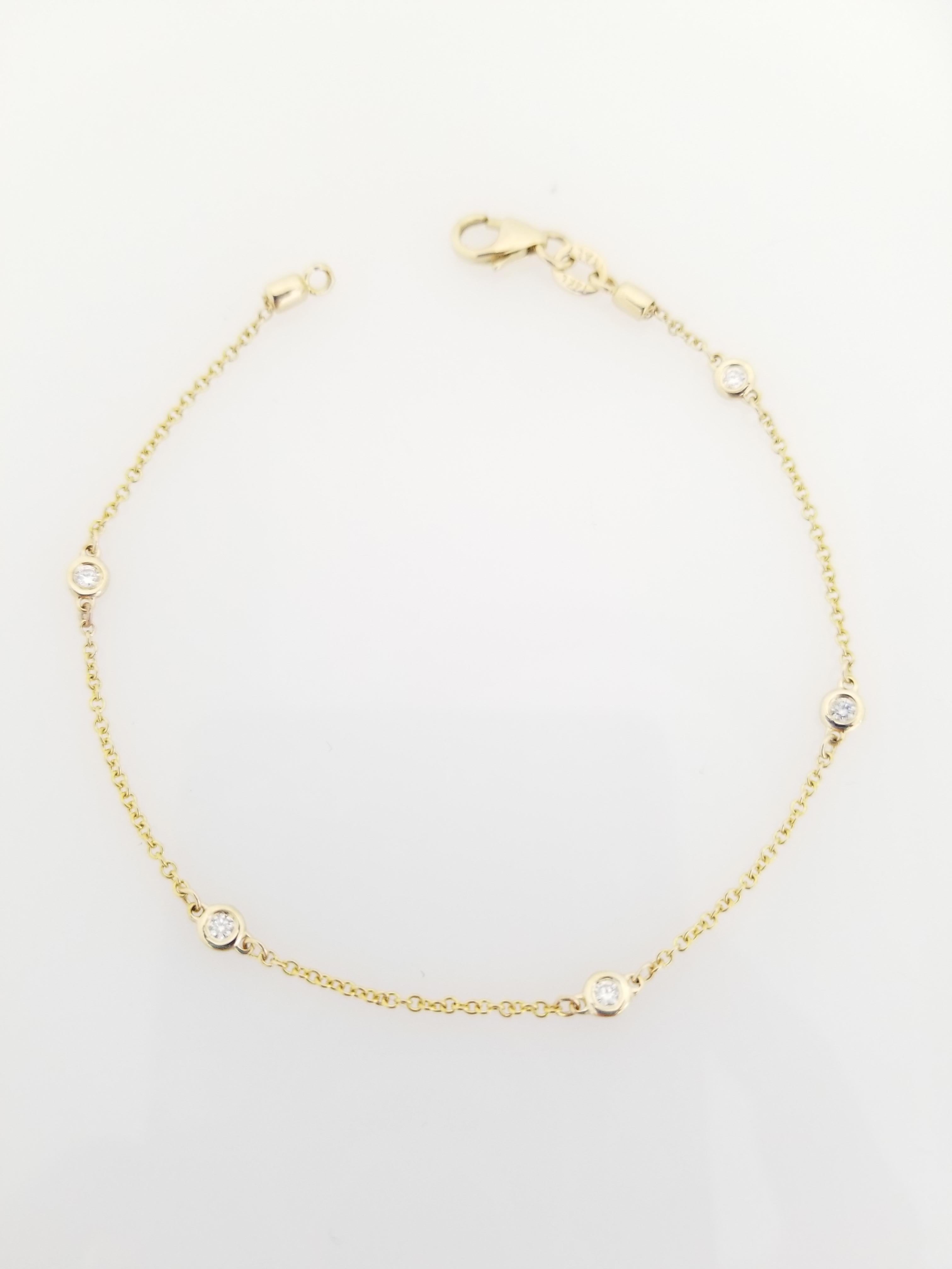 Beautiful Collection 5 Stations Diamond By The Yard Bracelet 14K Yellow Gold. 0.15 ctw. 7 Inch. 