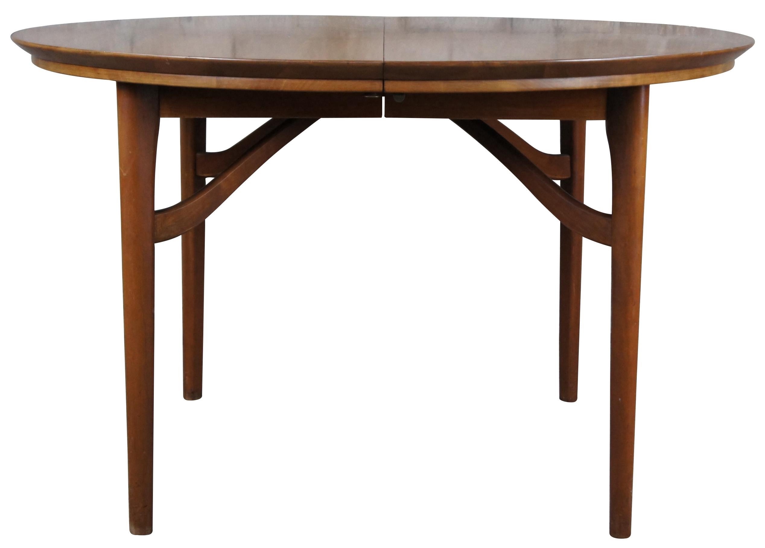 Statton Furniture mid century dining table. A round extendable form made from solid cherry with danish form. Sleek minimalist lines with a stunning wood grain. Great for use as a breakfast table or game table.

Statton Furniture was a staple in