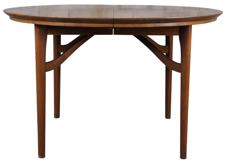 Statton Furniture mid century dining table. A round extendable form made from solid cherry with danish form. Sleek minimalist lines with a stunning wood grain. Great for use as a breakfast table or game table.

Statton Furniture was a staple in