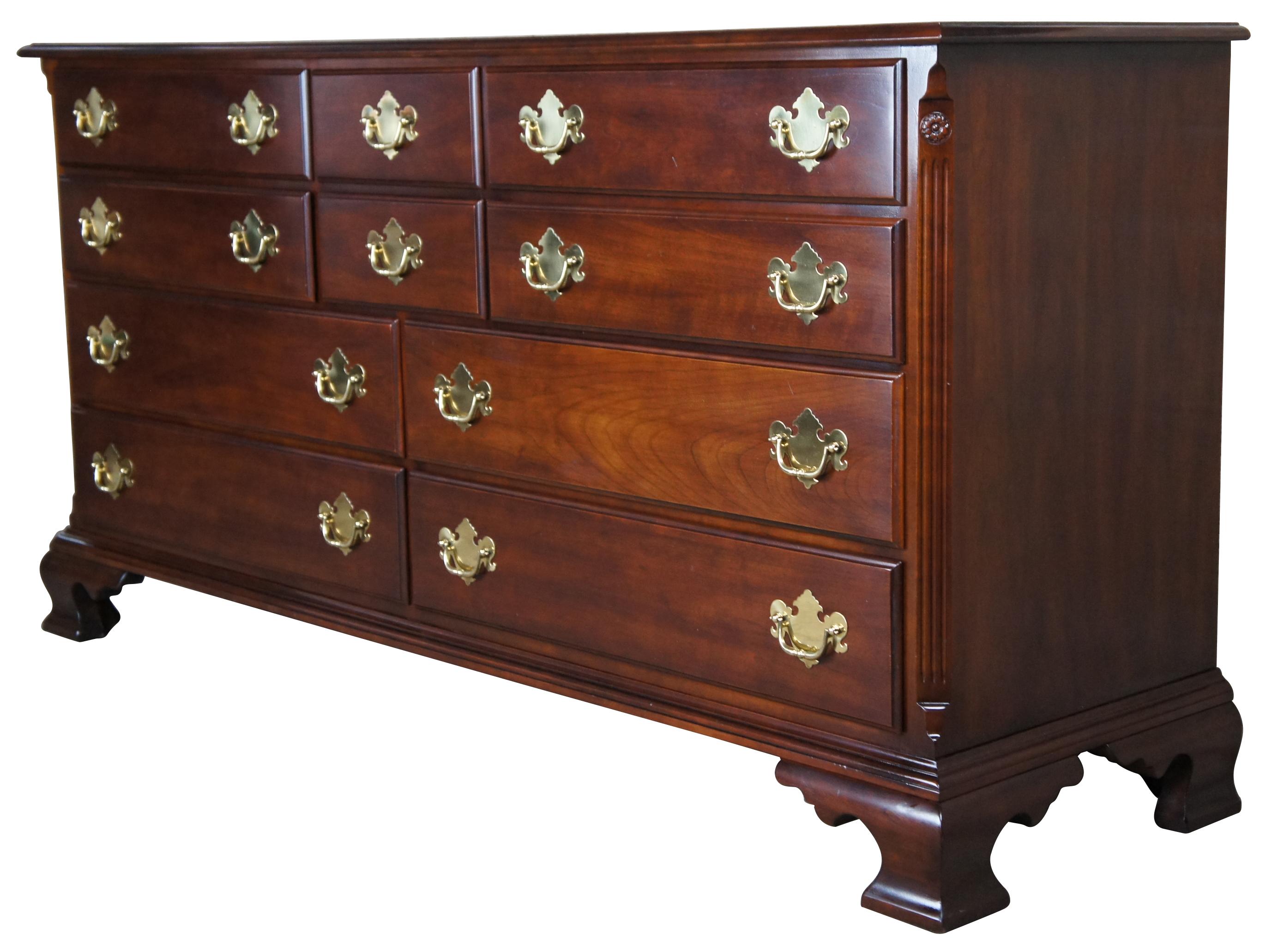 Vintage Chippendale style dresser by Statton Furniture. Solid cherry with their Old Towne finish, brass hardware, carved and fluted stiles ending in rams tongues and ogee bracket feet. Features six smaller drawers over four larger with dovetail