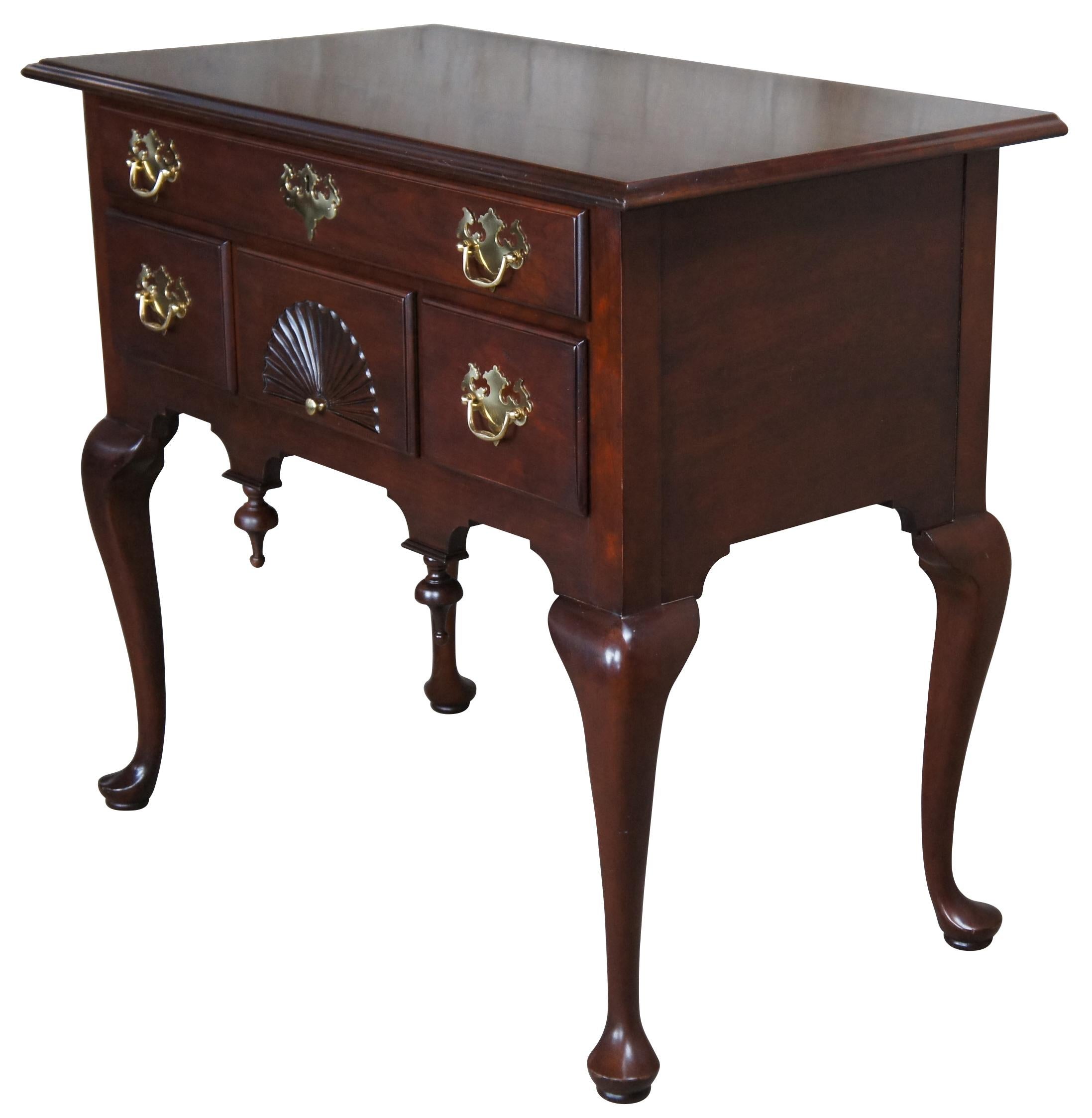 Vintage cherry lowboy from Statton's Private Collection, featuring Queen Anne and Federal styling with a rectangular top over four drawers with brass hardware, serpentine legs, pad feet, carved fan and drop pendants.

Statton Furniture was a