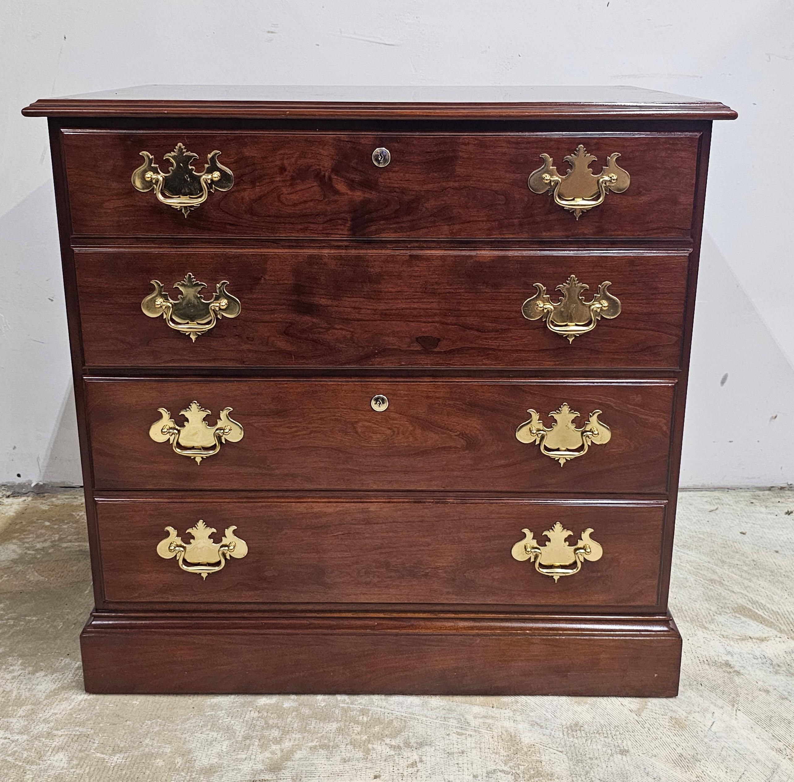 A late 20th Century Statton Trutype Americana Chippendale Style Solid Black Cherry Lateral Filing Cabinet. Bottom prepared for wheels should want a rolling filing cabinet. We have two available.
Measures 31.5 