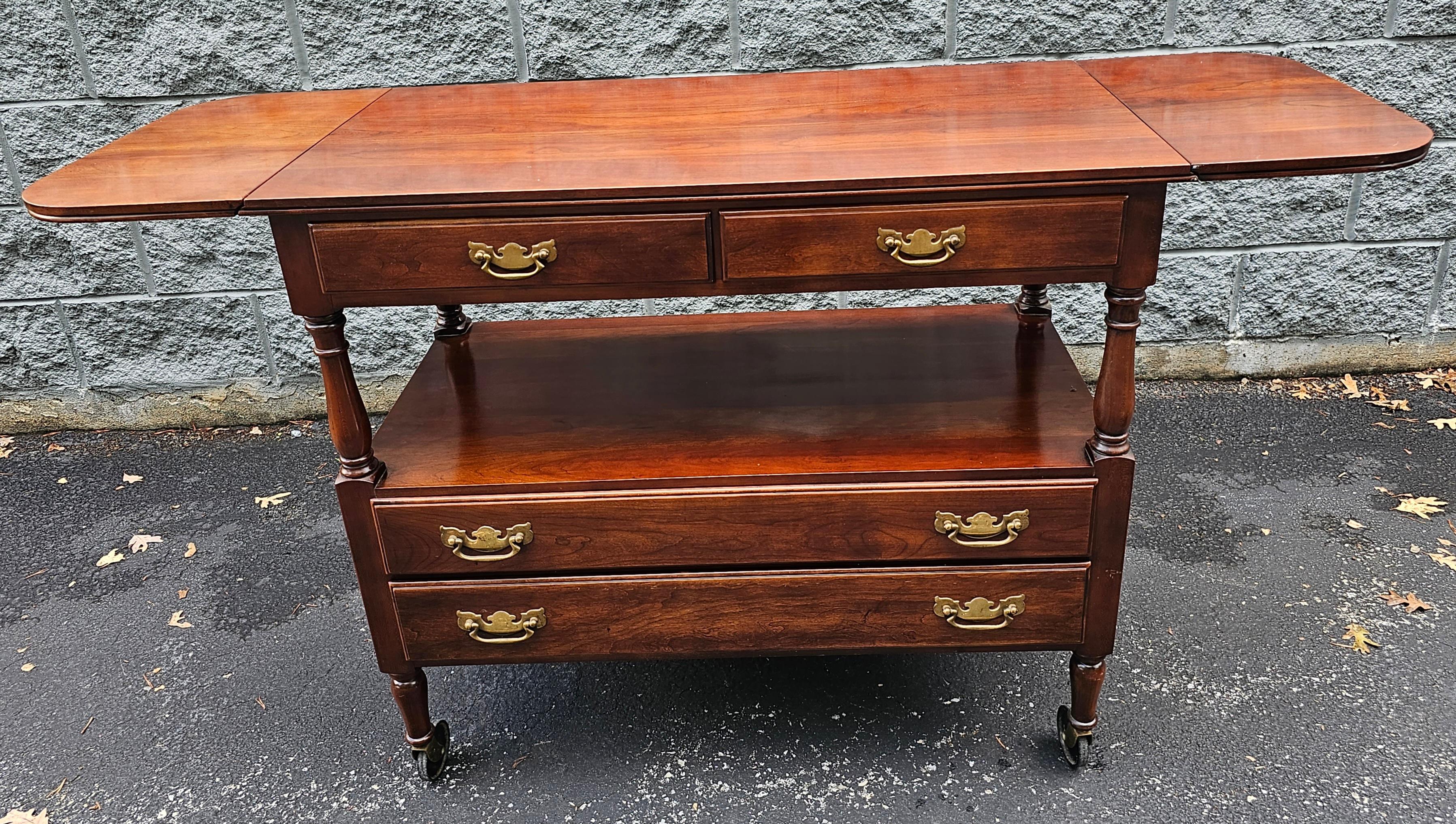 Mid Century Statton Trutype Furniture Two tier Cherry Four-Drawer Rolling Drop-Leaf Dry Bar and Buffet Server with 4 large drawers for ample storage. Measures 37.
