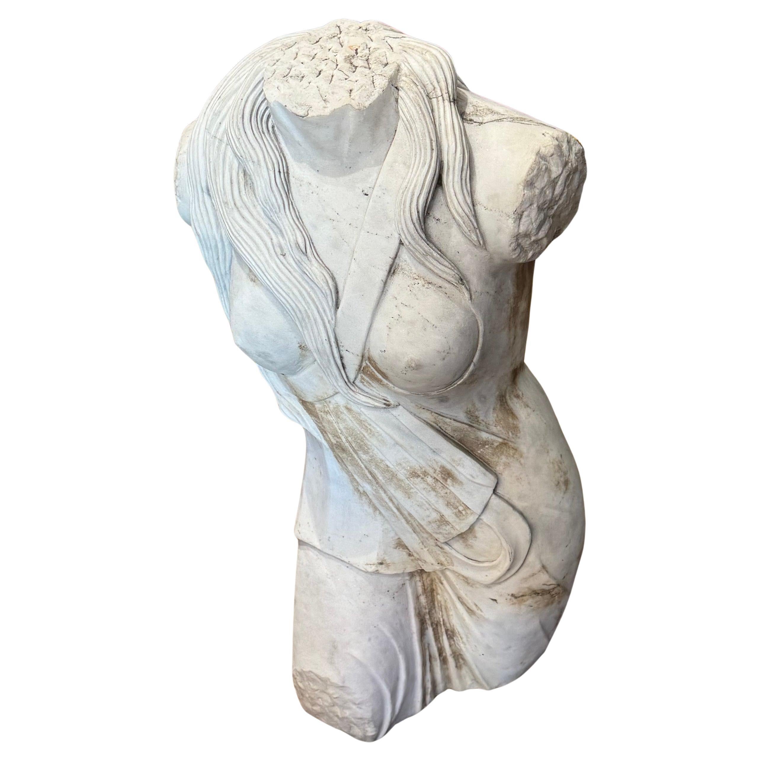 The sculpture has a distinctly Art Deco flavor even though it  's copied from an ancient statue.
Grandly scaled & highly unusual in its bold appearance, the sculpture is solid statuary marble with a carved flat, base, for easy installation on a