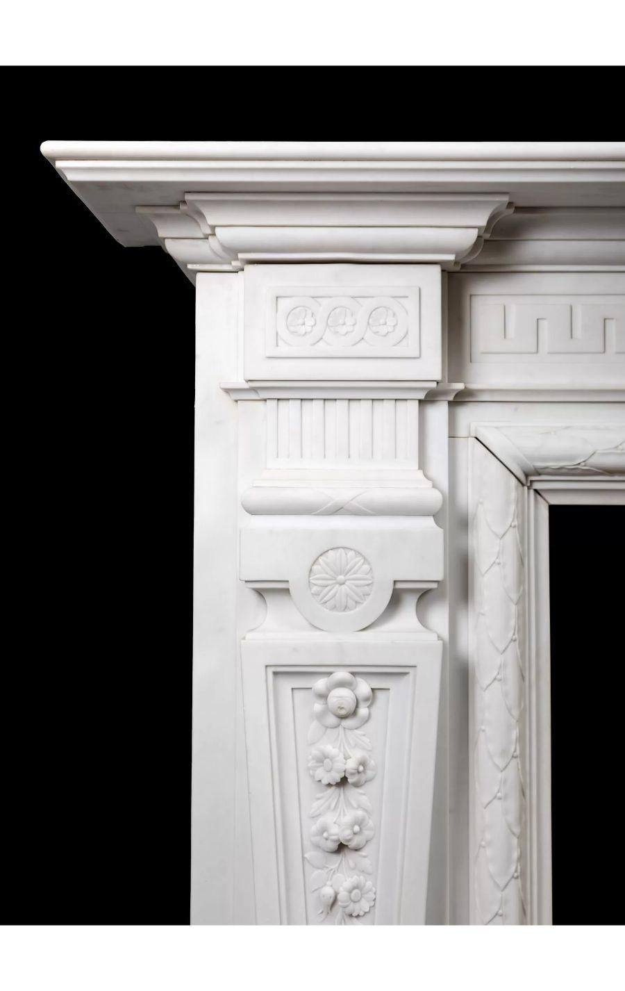 A large English antique carved white Statuary marble fireplace from the late Victorian/Edwardian period.

A very well proportioned and attractive fireplace which was made approximately 120 years ago using the purest imported Italian Statuary marble.