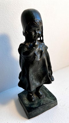 Statue "Girl Holding a Shoe" in the style of Juan Clara