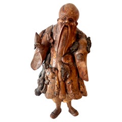 Estatua tallada a mano en raíz, representando al "Inmortal Li", época de la dinastía Qing, China