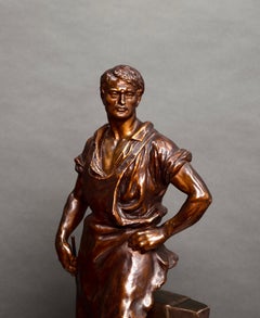 Statue of a blacksmith with bronze patina