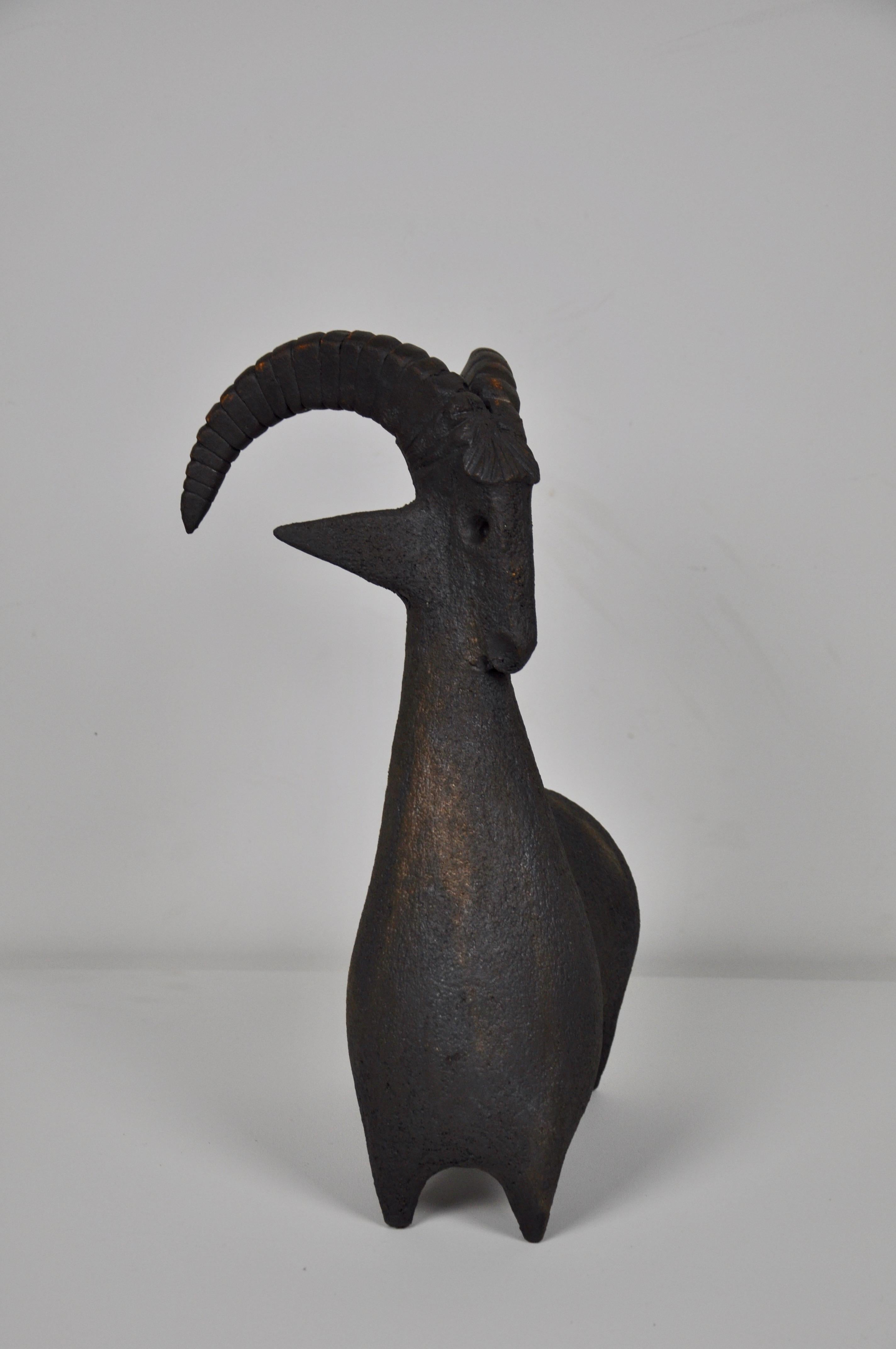 Ceramic statue in the shape of a goat.