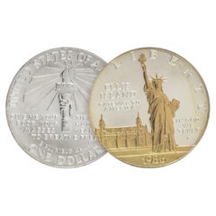 Pièce d'un dollar en argent avec des reflets dorés « Statue de la Liberté – Ellis Island 1986 », pièce de monnaie