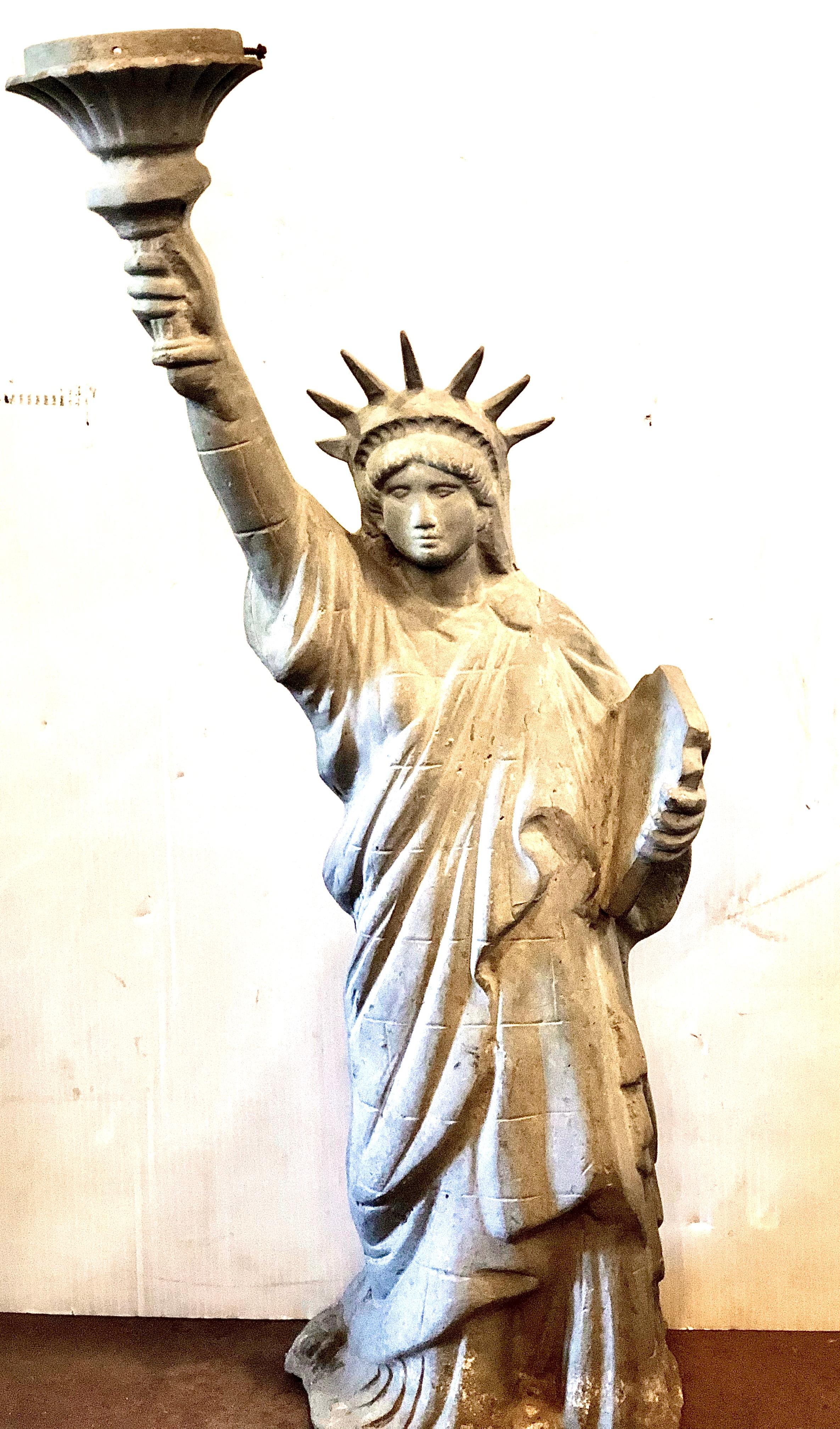 Very unique cast aluminum Statue of Liberty light. Currently not wired. Striking as piece of art but also excellent potential to be restored as a working light.