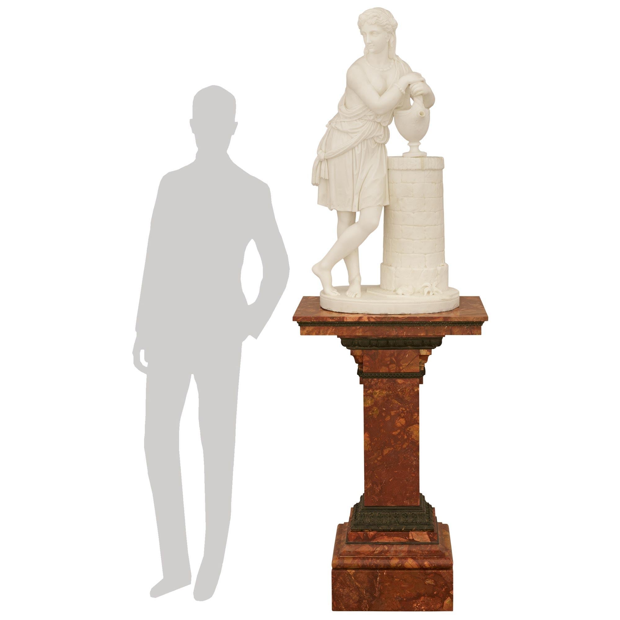 A spectacular and most impressive Italian 19th century white Carrara and Diaspro Tenero marble statue of Rebecca at the well, signed by Carmelo Fontana. Rebecca is standing proudly on an oval shaped marble base with foliage and is leaning beside a