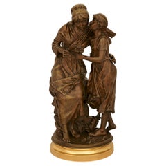 statue titled Fête de la Petite Mère, signed by Émile Nestor Joseph Carlier