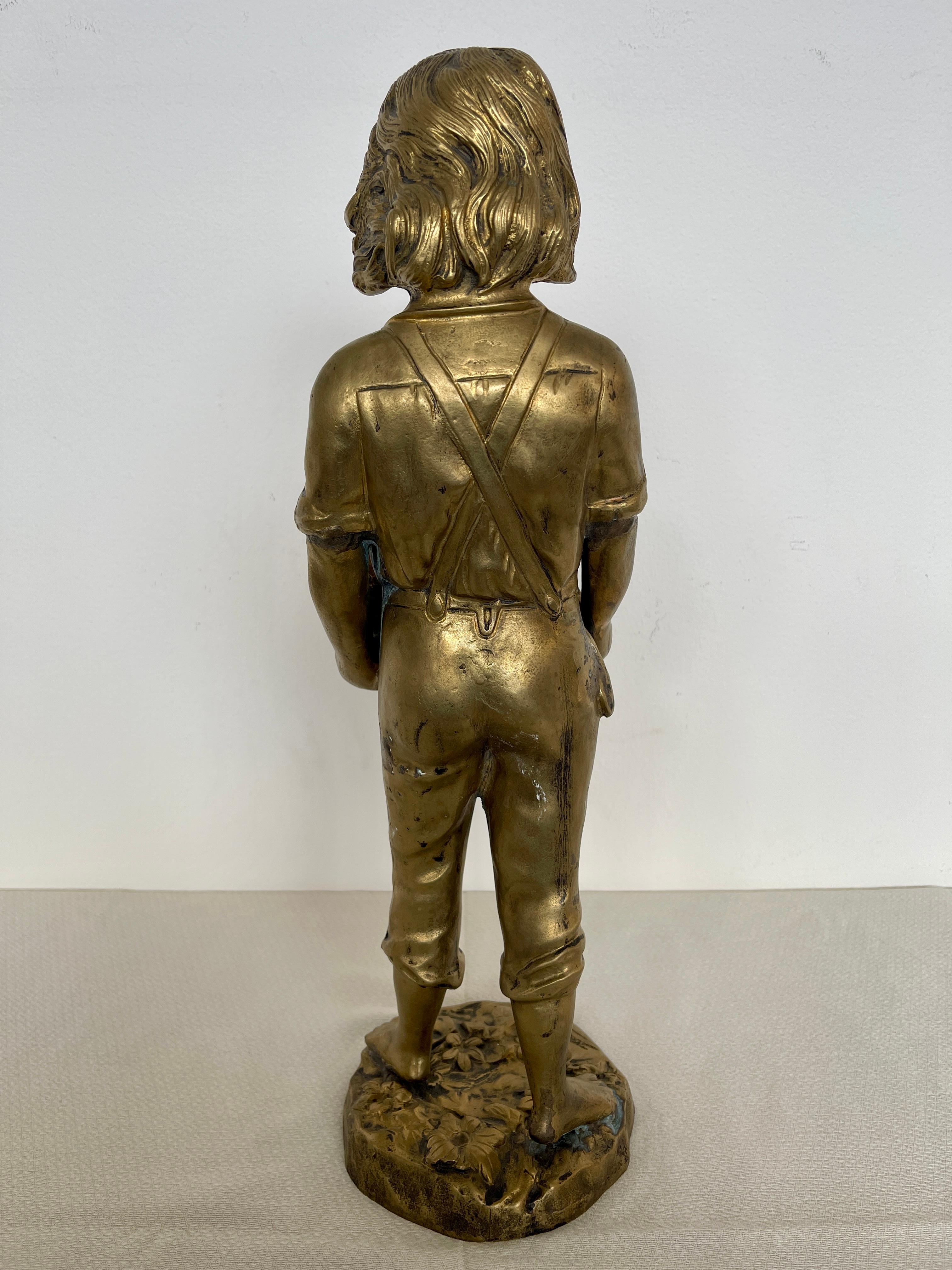 Statuette en bronze représentant un enfant avec des chiots 19e siècle en vente 3