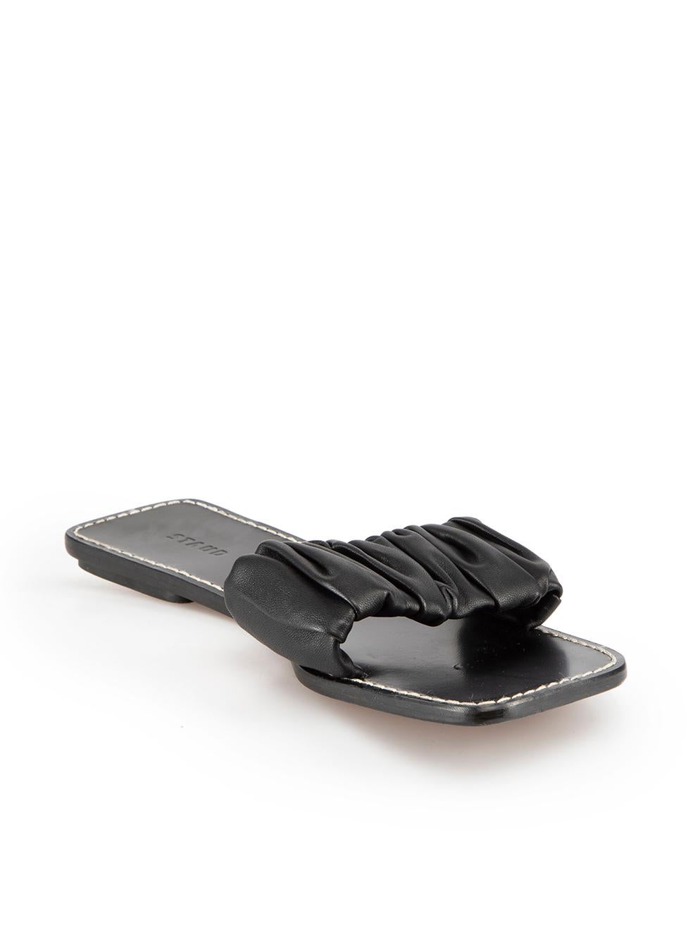 CONDITION is Very good. Minimal wear to shoes is evident. Minimal wear to the left shoe footbed with a scratch to the leather on this used STAUD designer resale item.
 
 Details
 Black
 Leather
 Slide sandals
 Ruched accent strap
 Open square toe
