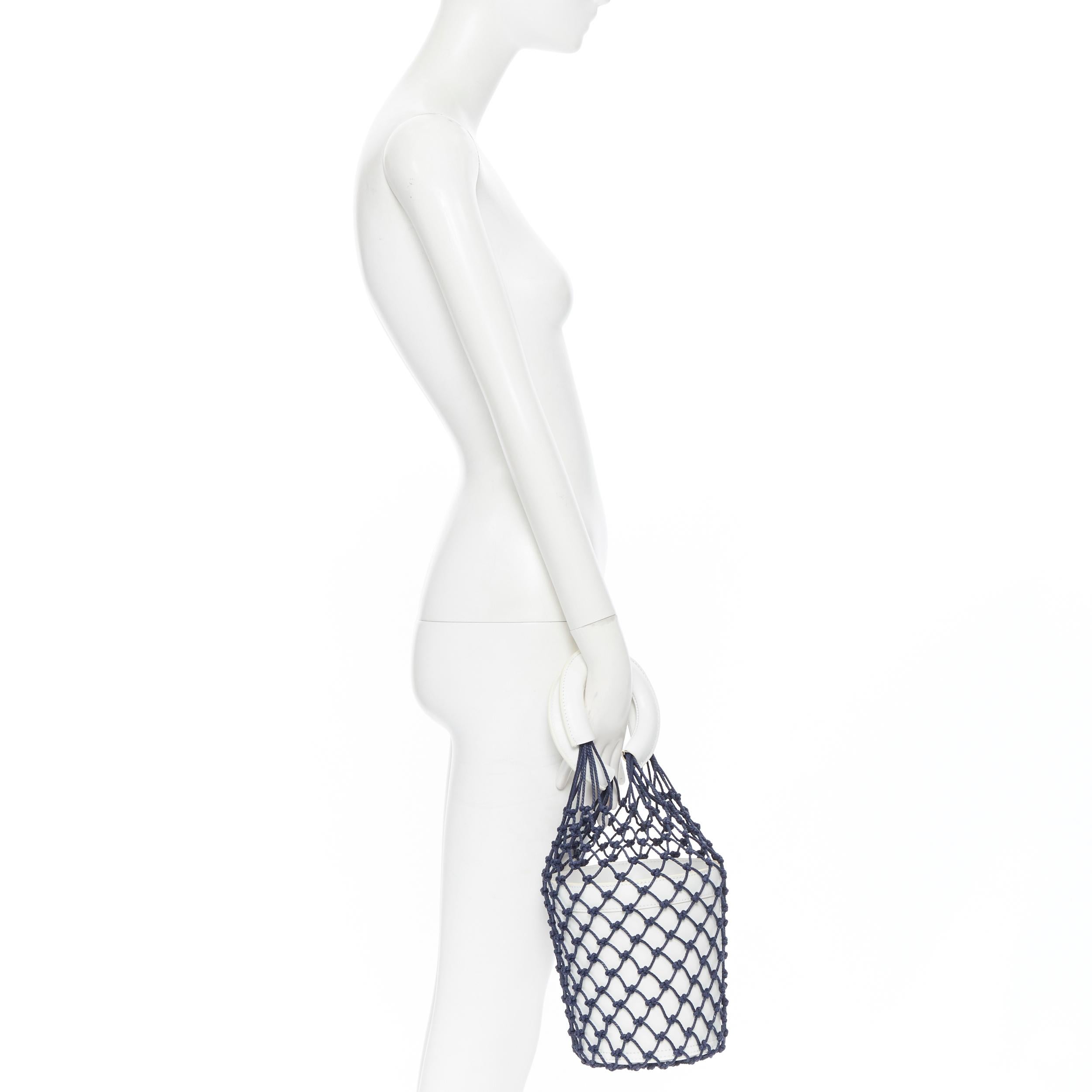 STAUD Moreau Net navy fishnet white leather bucket bag
Brand: Staud
Model Name / Style: Moreau bucket bag
Material: Leather
Color: White, navy
Pattern: Solid
Extra Detail: Moreau bag. Fishnet upper. 
Made in: China

CONDITION: 
Condition: Good, this
