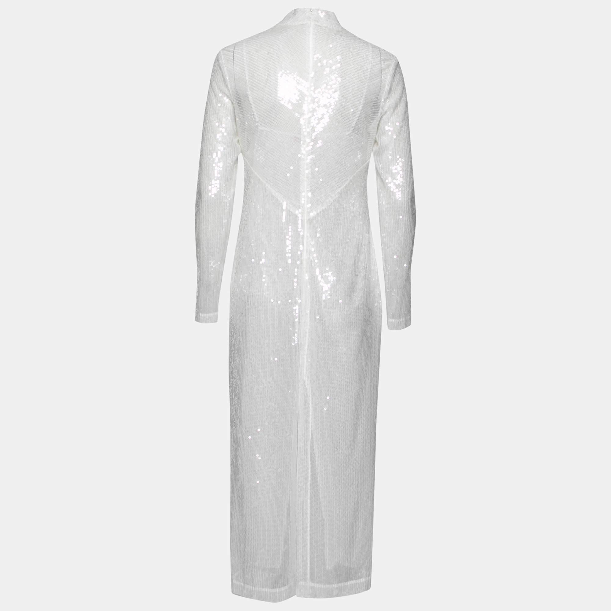 Show your love for glamorous fashion by donning this elegant sequin embellished dress from Staud. It comes draped in fine materials with a midi length and long sleeves. The white dress is truly flattering and is equipped with a zip closure at the