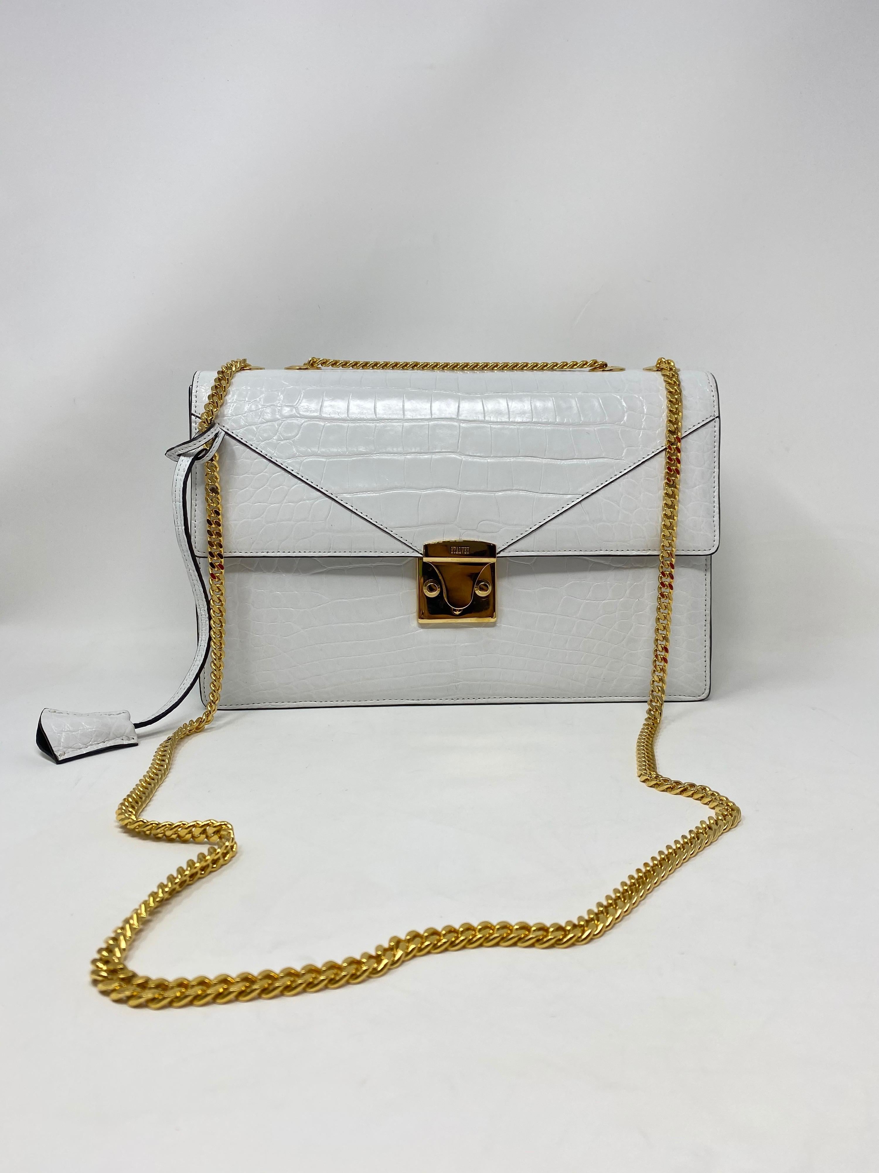 Jason Stalvey White Lizard Handbag. Brand new. Purchased from an exclusive trunk show at Nieman Marcus. Stalvey rare white lizard handbag with gold hardware. The bag measures 12x8x 3. The strap has 12-22” drop. Don't miss out on this one of a kind