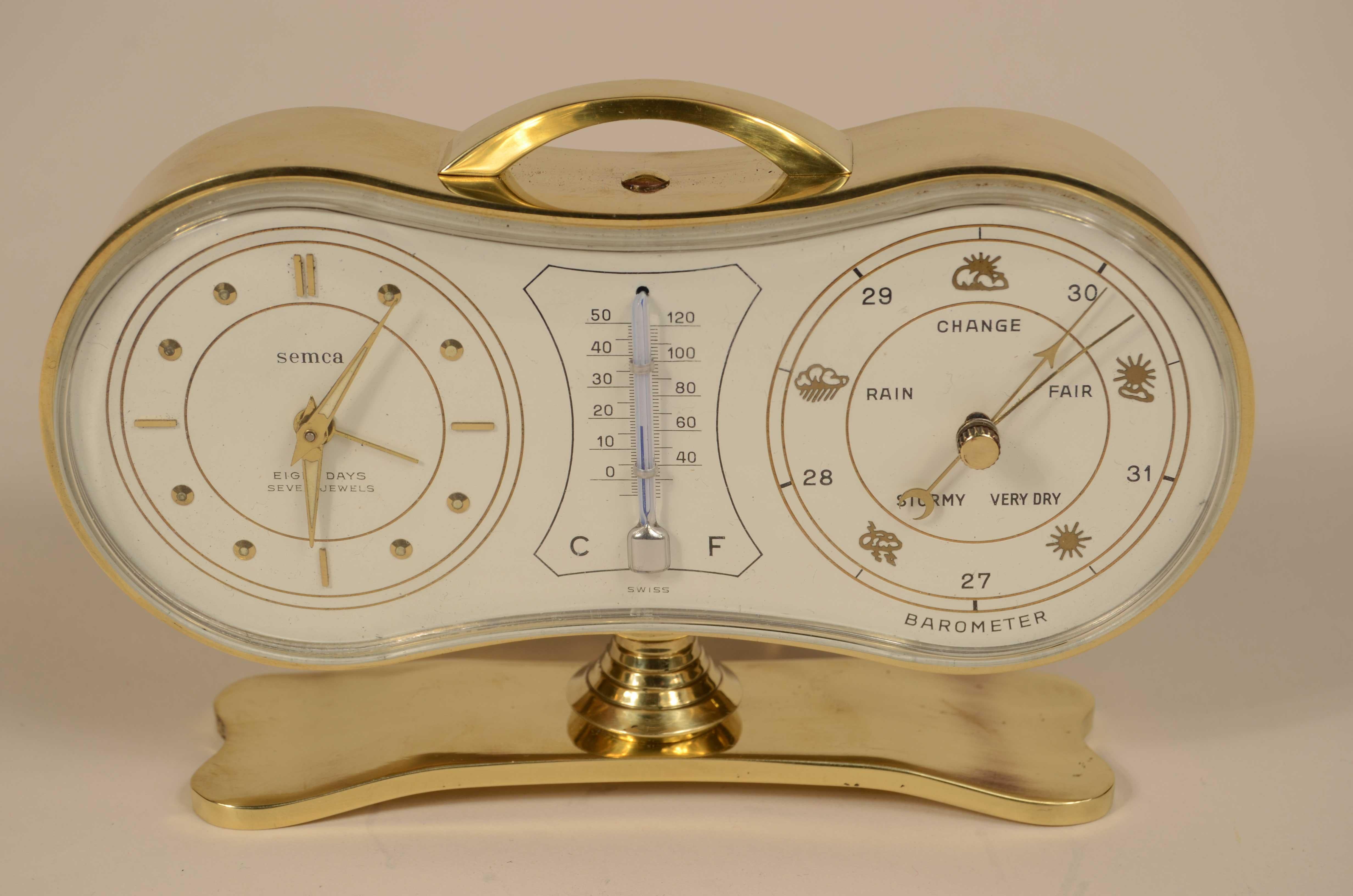 Eine Barometer-Tischstation aus Messing von Semca Swiss, die in den 1950er Jahren für den amerikanischen Markt hergestellt wurde. Sie besteht aus einem Aneroid-Barometer, einem Thermometer mit doppelter Celsius- und Fahrenheit-Skala und einer Uhr