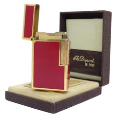 Used S.T.Dupont red lacquer and plated gold lighter collection