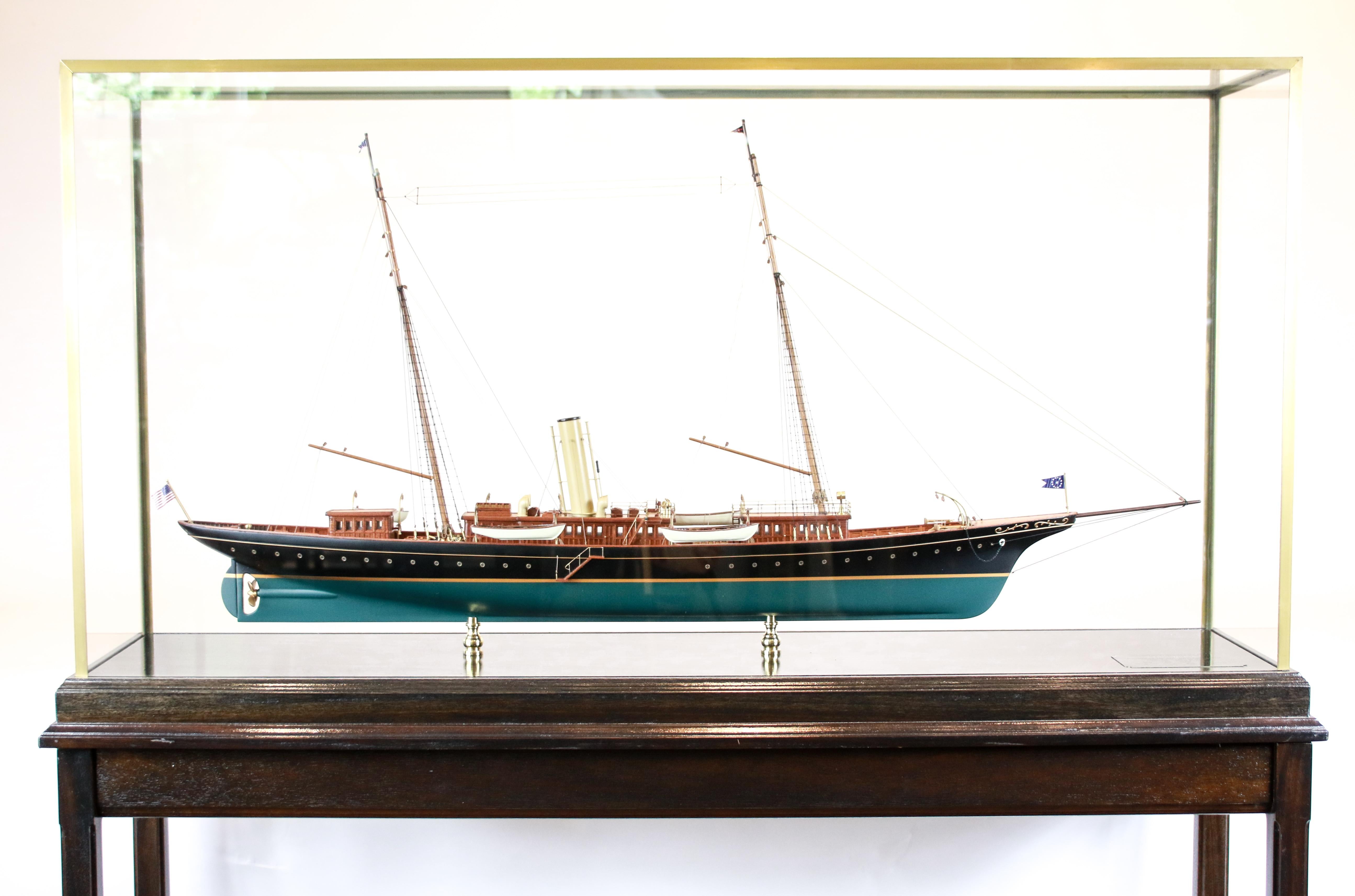 Private steam yacht of J. Pierpont Morgan, Corsair in brass and glass display case with custom wooden table stand.
Many fine details include capstan, helm, binnacle, winch, funnel, lifeboats, portholes, cabins, doors etc.
Morgan commissioned three