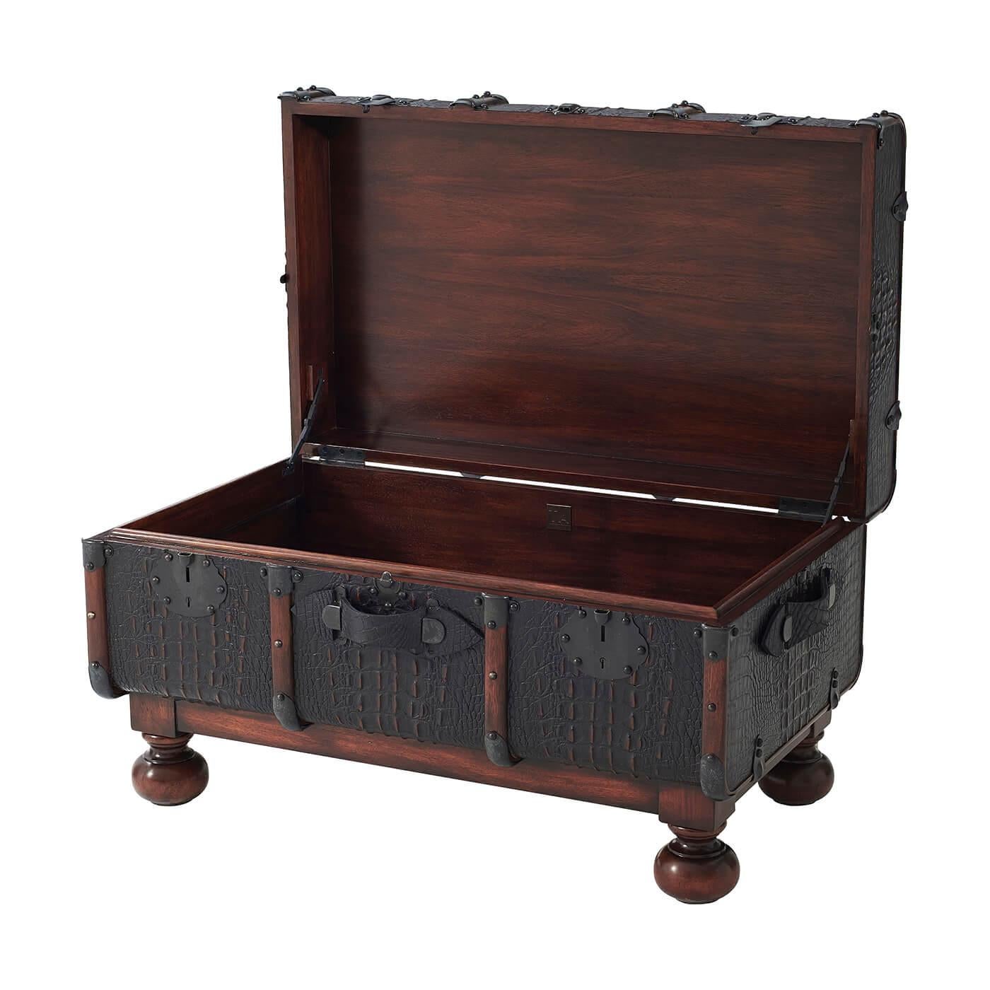 A Kalahari paneled steamer trunk with wooden and brass-mounted ribs, the hinged lid fixed with brass clasps on turned bun feet. The original circa 1920.

Dimensions: 33.75