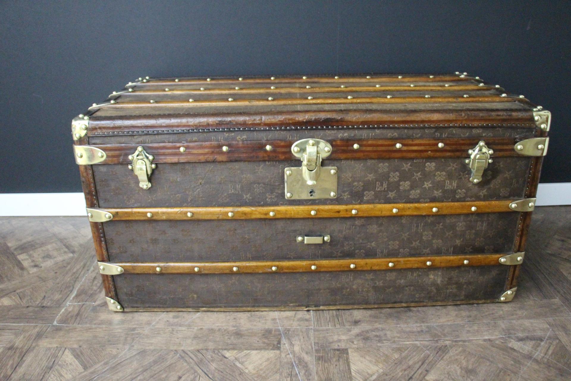 This superb steamer trunk dates back to around 1890-1900's. It features wooven MB monogram canvas for Morand and Bigot, all chocolate color leather trims, solid brass clasps, solid brass main lock and side handles.Its main lock as well as lis large