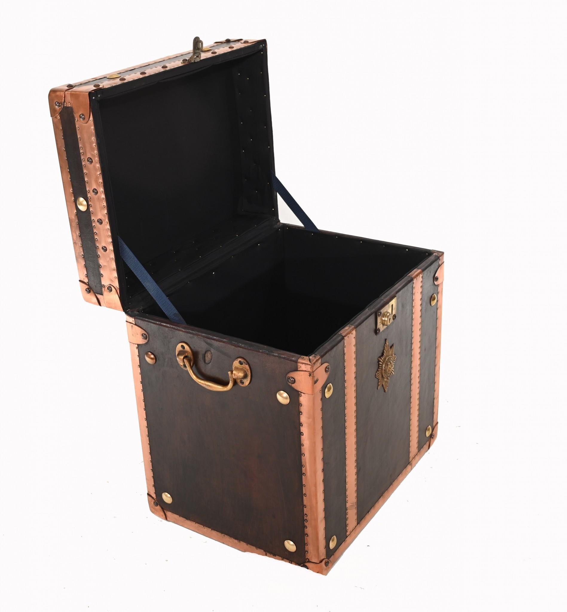 Very cool leather and copper luggage case
Steamer trunk look - very on trend in the world of interiors
Can function as a nifty looking side table
Some of our items are in storage so please check ahead of a viewing to see if it is on our shop