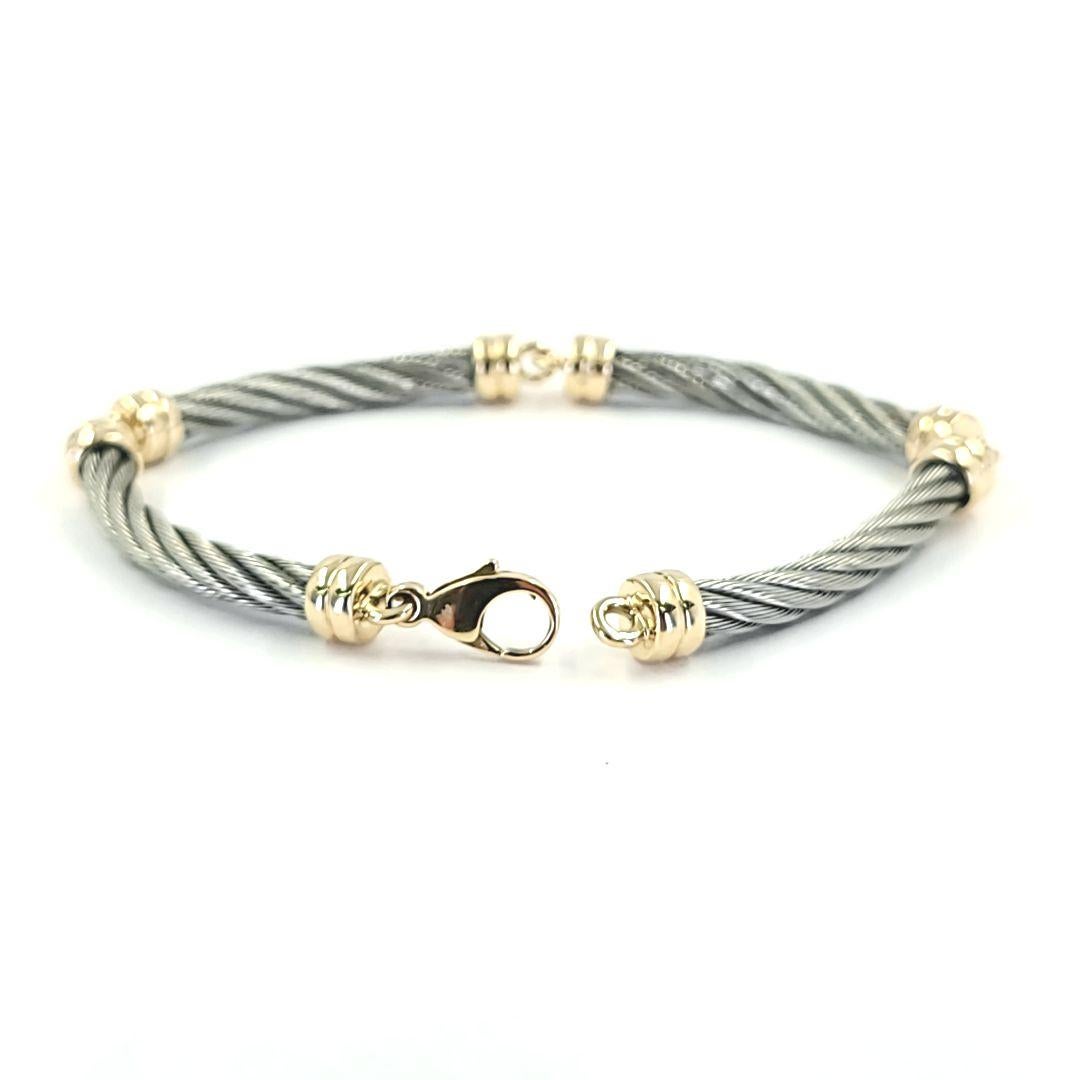 Steel and 18 Karat Yellow Gold Cable Bracelet In Good Condition In Coral Gables, FL