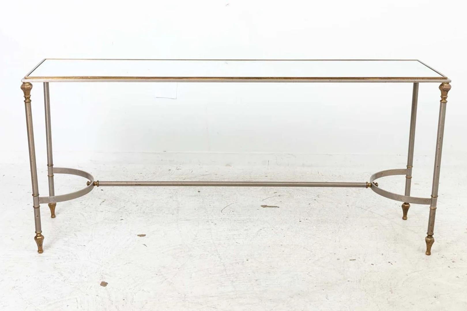 Steel And Brass Console Table with mirror inset top. Original patina present. Some scratches to mirror top. Overall good condition, ready to use