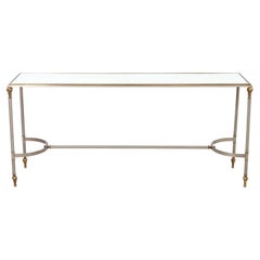 Mesa consola de acero y latón