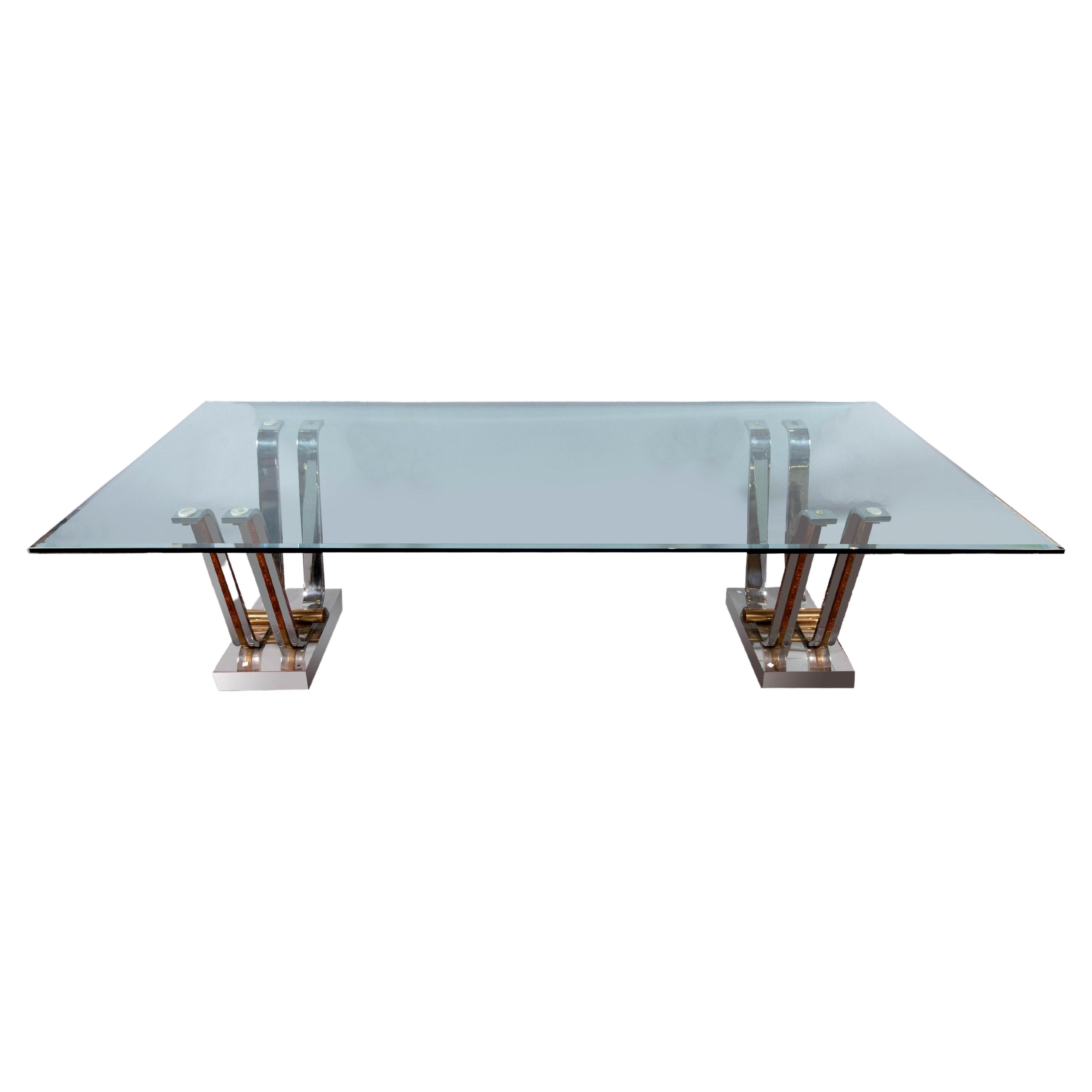 Pair of metal tulip table bases designed and manufactured by Karl Springer, Ltd circa 1970-80s. The bases are currently configured as a pair of console tables with new beveled glass tops (0.5 inch thick and included if wish). The pair can also be