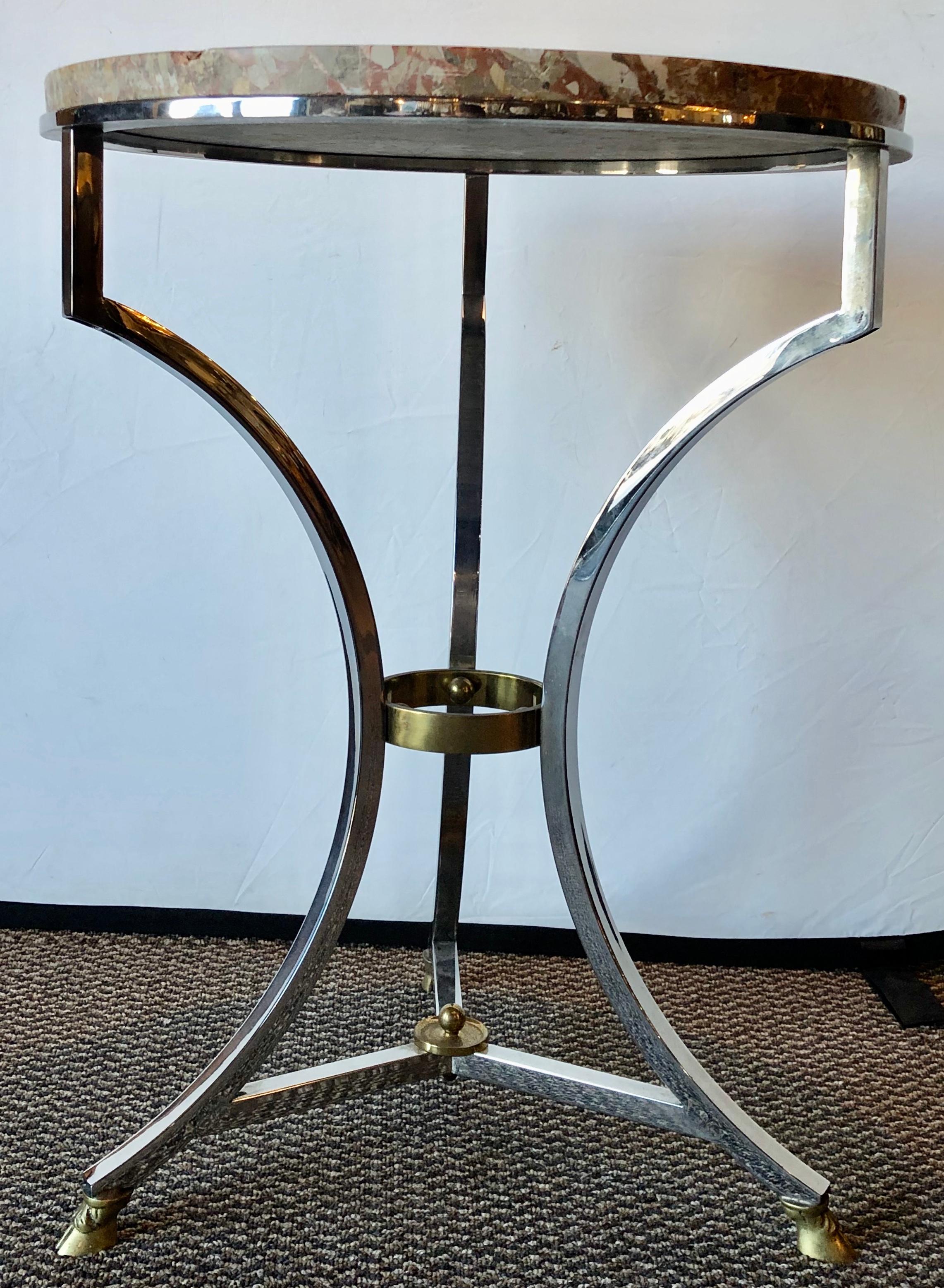 Steel and bronze Jansen Claw foot Bouilliotte or end table with a marble top. The finely detailed Hollywood Regency table having brass feet leading to a strong steel curved frame with a brass and steel cross bar. The base supporting a rouge gray and