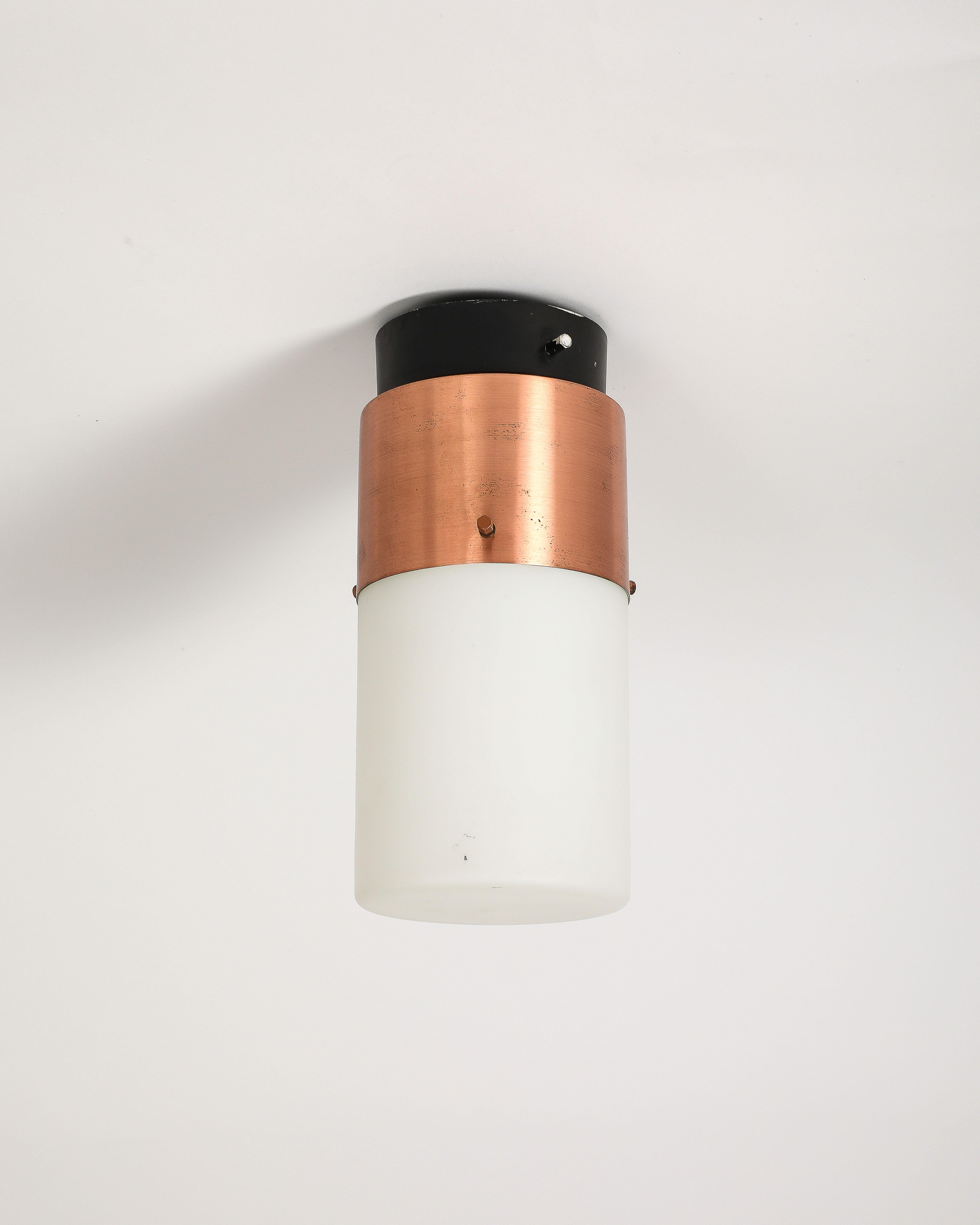 Steel and copper flush mount light.