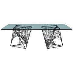 Table de salle à manger moderniste en acier et verre