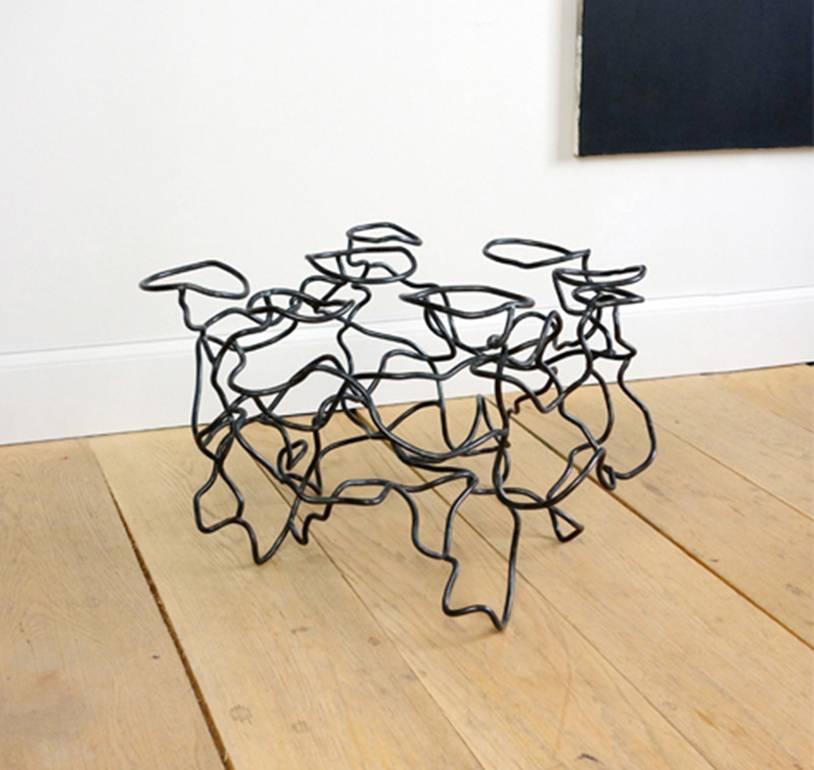 New York artist Rebecca Welz’s sculptural “Scribble Table” side table is made of steel rods that are bent, twisted, and welded into an artful tangle or “scribble.” Welz has described her welded steel sculptures as “large, kinetic drawings in space,”