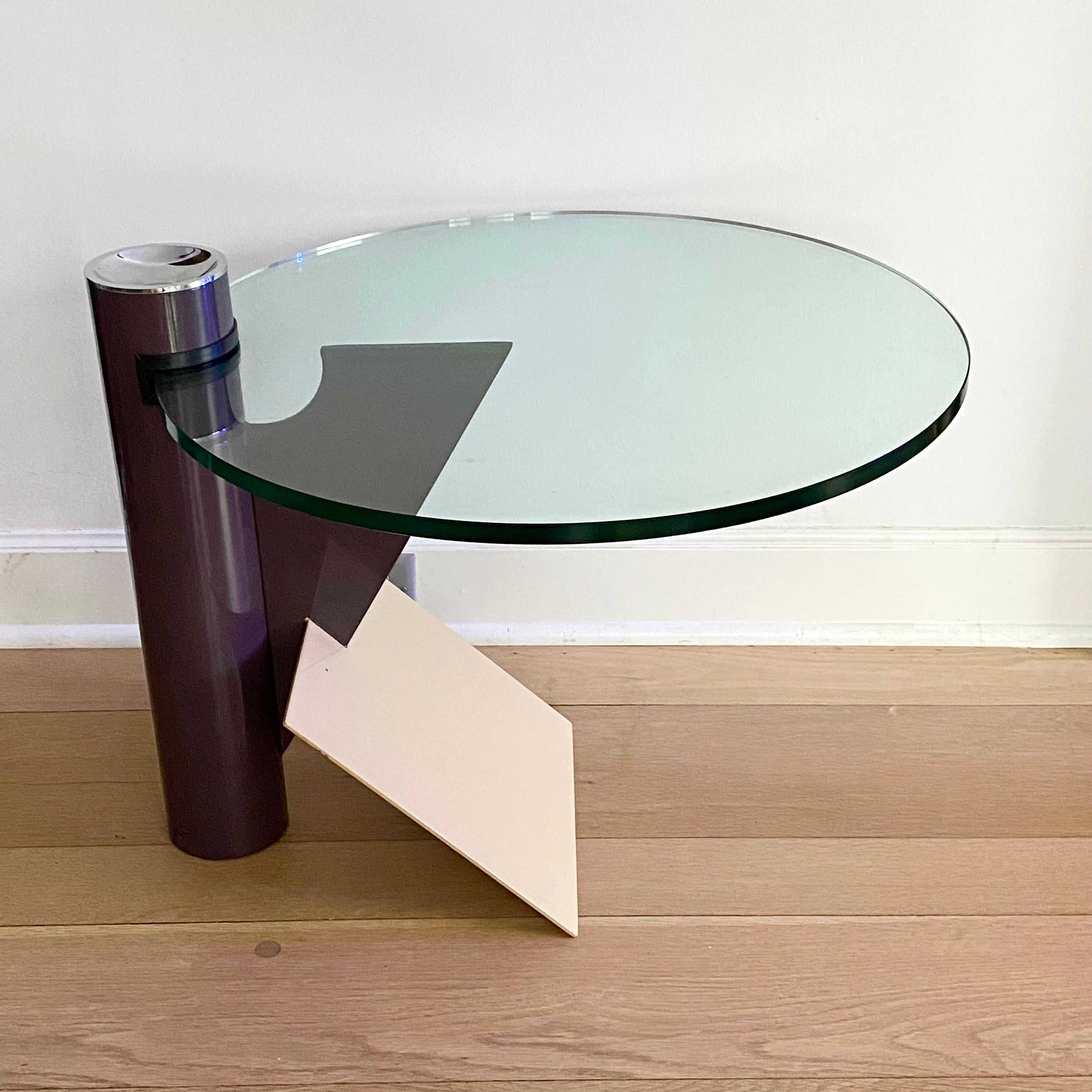 Post-modern side table designed by Memphis Milano member Peter Shire (b. 1947) for Saporiti, Italy 1983. Enameled steel, glass, rubber and chrome. Aubergine / purple base with angled tan /beige support piece. Removable chrome ashtray on top. Heavy