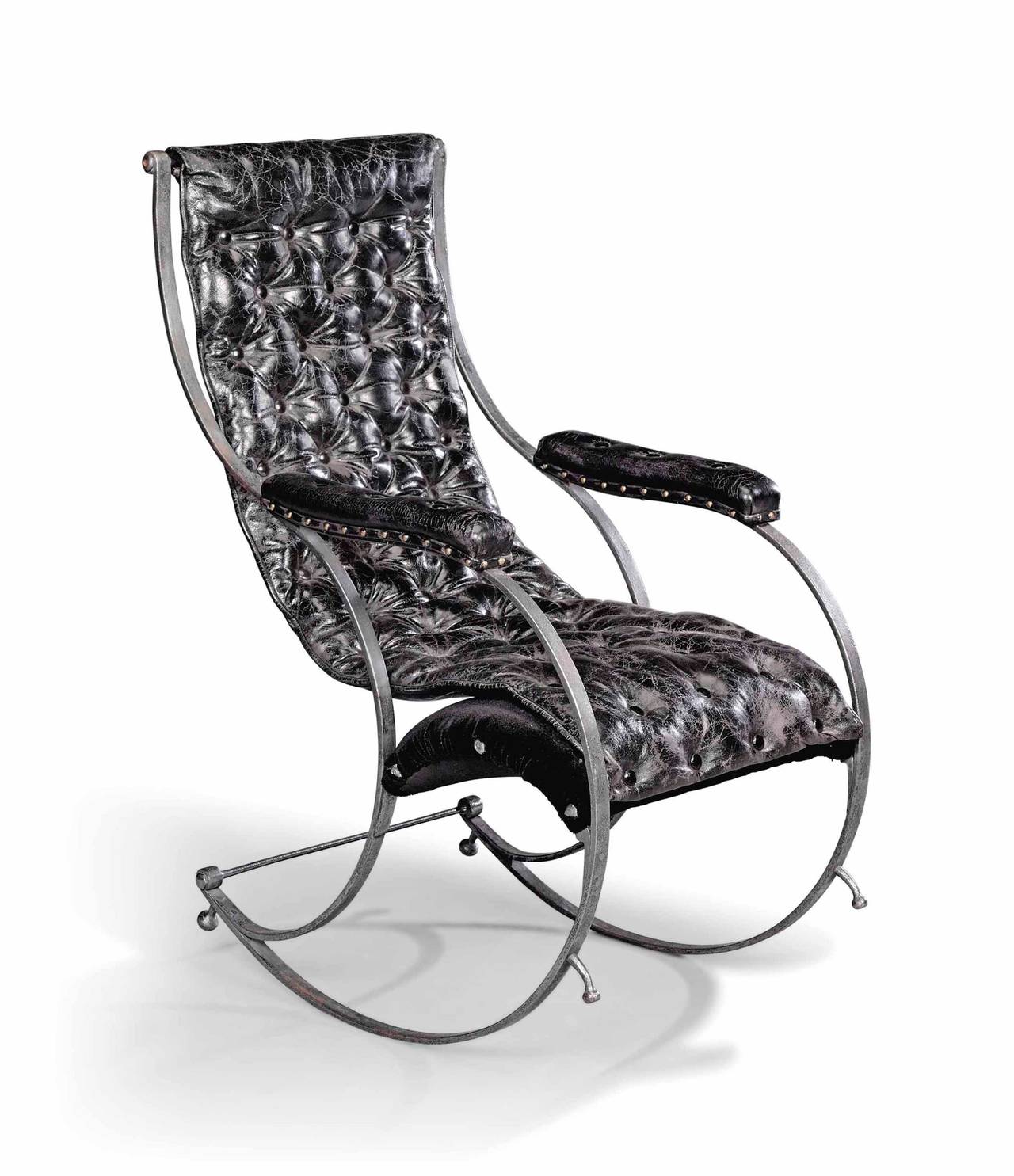 A strip metal steel frame rocking chair in the manner of R. W Winfield, reupholstered in new black distressed leather.