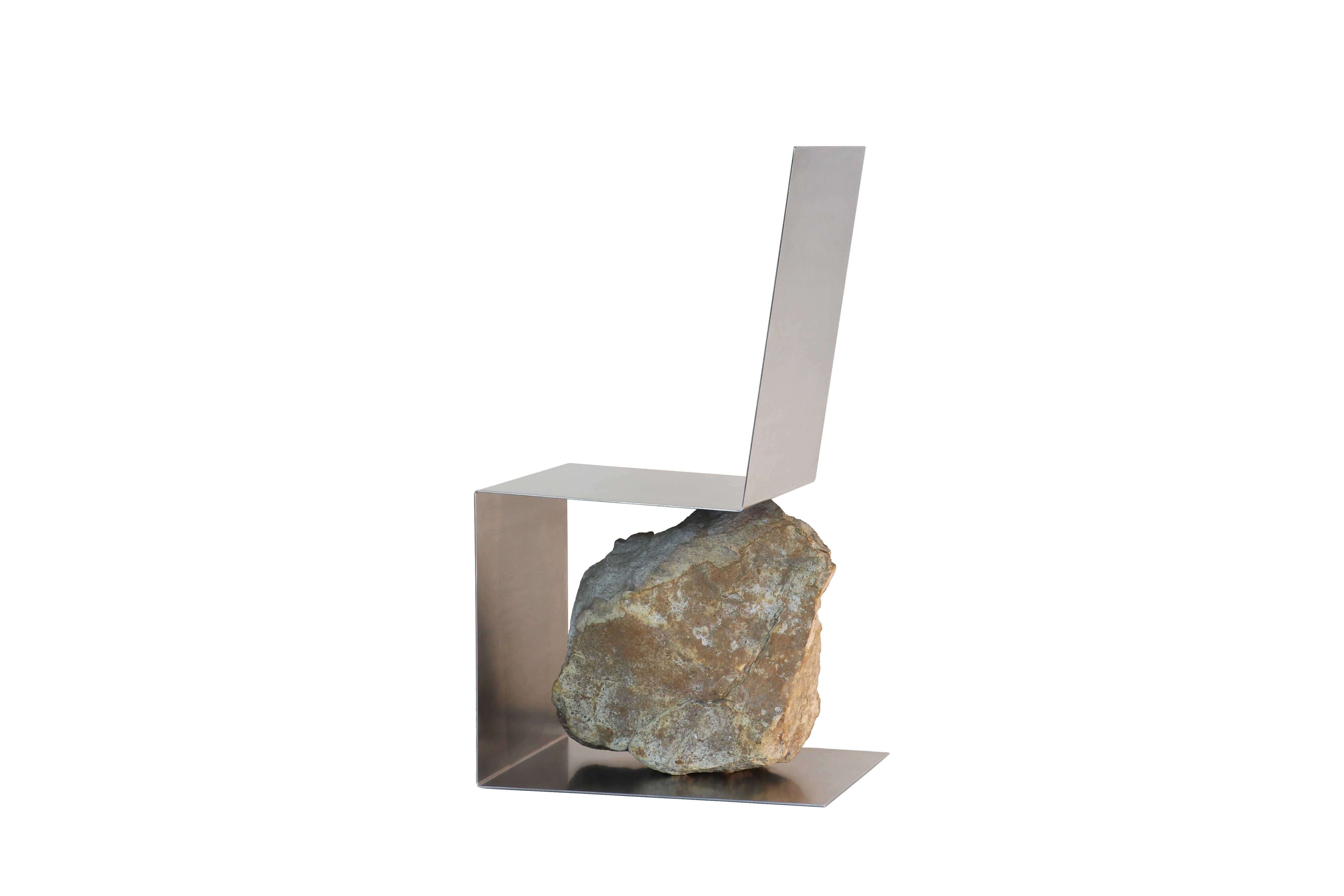 Steel and stone chair by Batten and Kamp
Shelter to Ground Collection
Dimensions: W 44 cm x D 54 cm x H 97 cm
Materials: Hand finished stainless steel, natural stone.

The stone is sourced first, and then the proportions of the steel adjusted