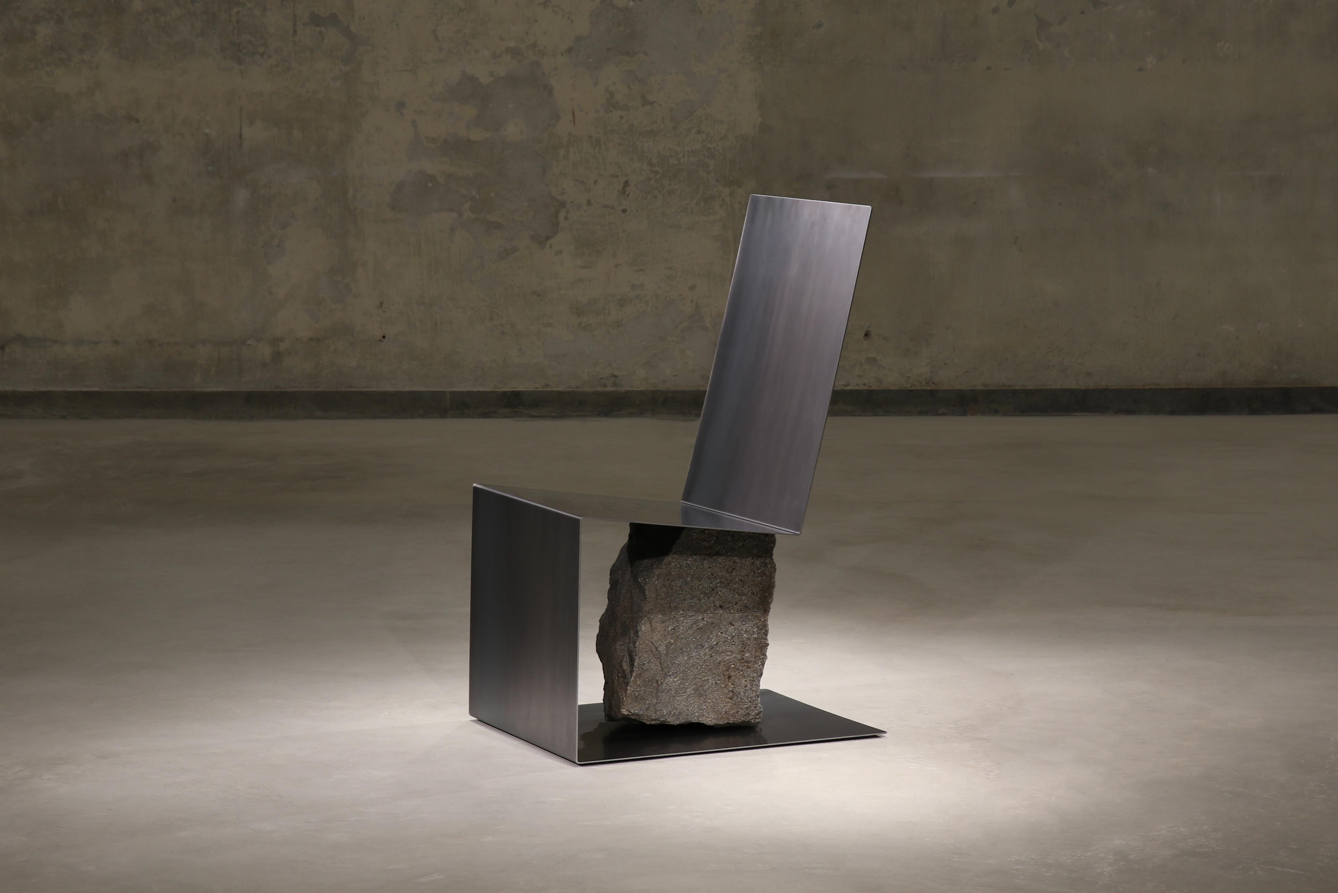 Steel and stone chair by Batten and Kamp
Shelter to Ground Collection
Dimensions: W 48 x D 61 x H 95 cm
Materials: Hand finished hot rolled steel, natural stone

The stone is sourced first, and then the proportions of the steel adjusted to suit