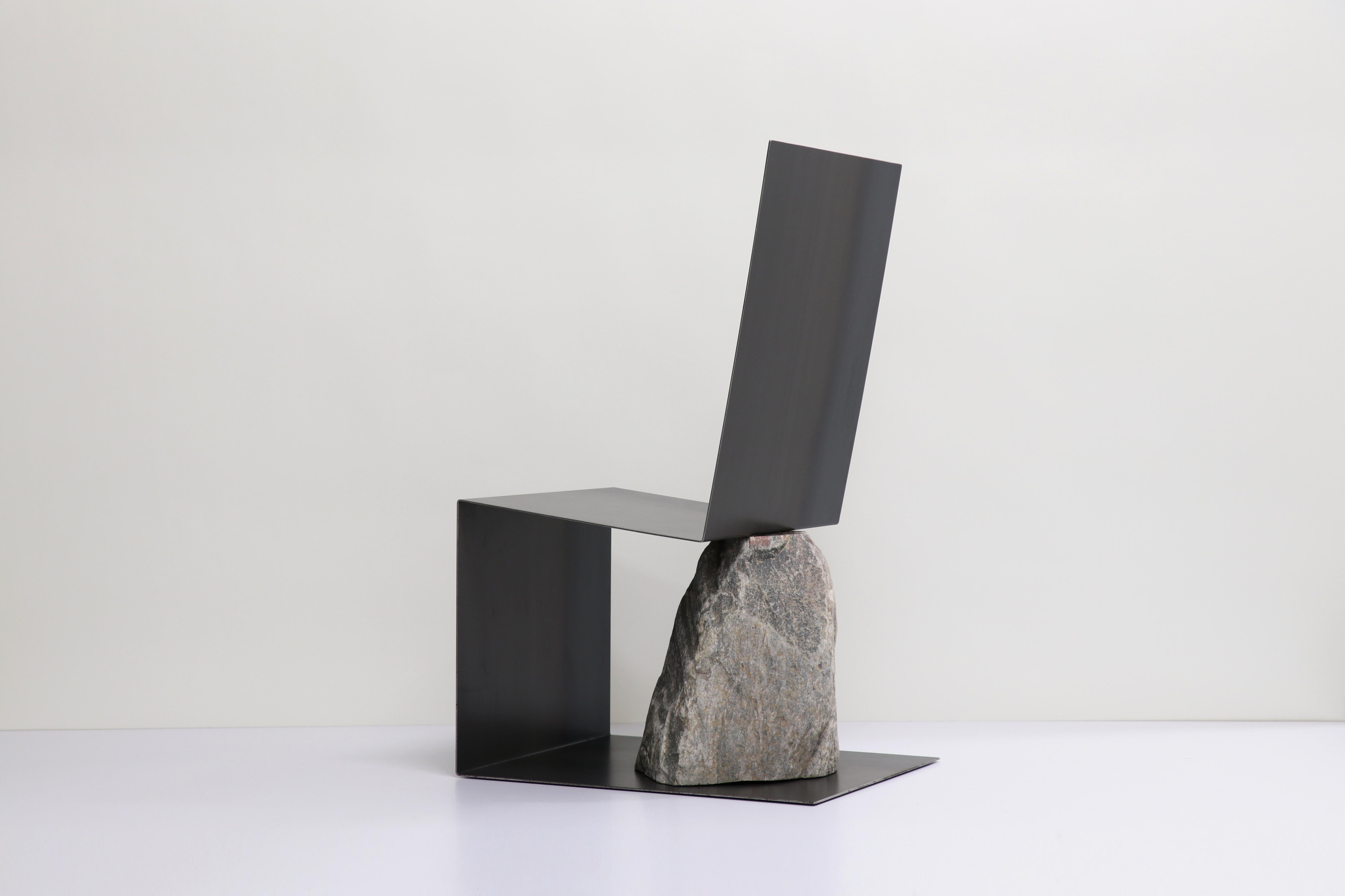 Steel and stone chair by Batten and Kamp
Shelter to Ground Collection
Dimensions: W 48 x D 61 x H 95 cm
Materials: Hand finished hot rolled steel, natural stone.

The stone is sourced first, and then the proportions of the steel adjusted to suit the
