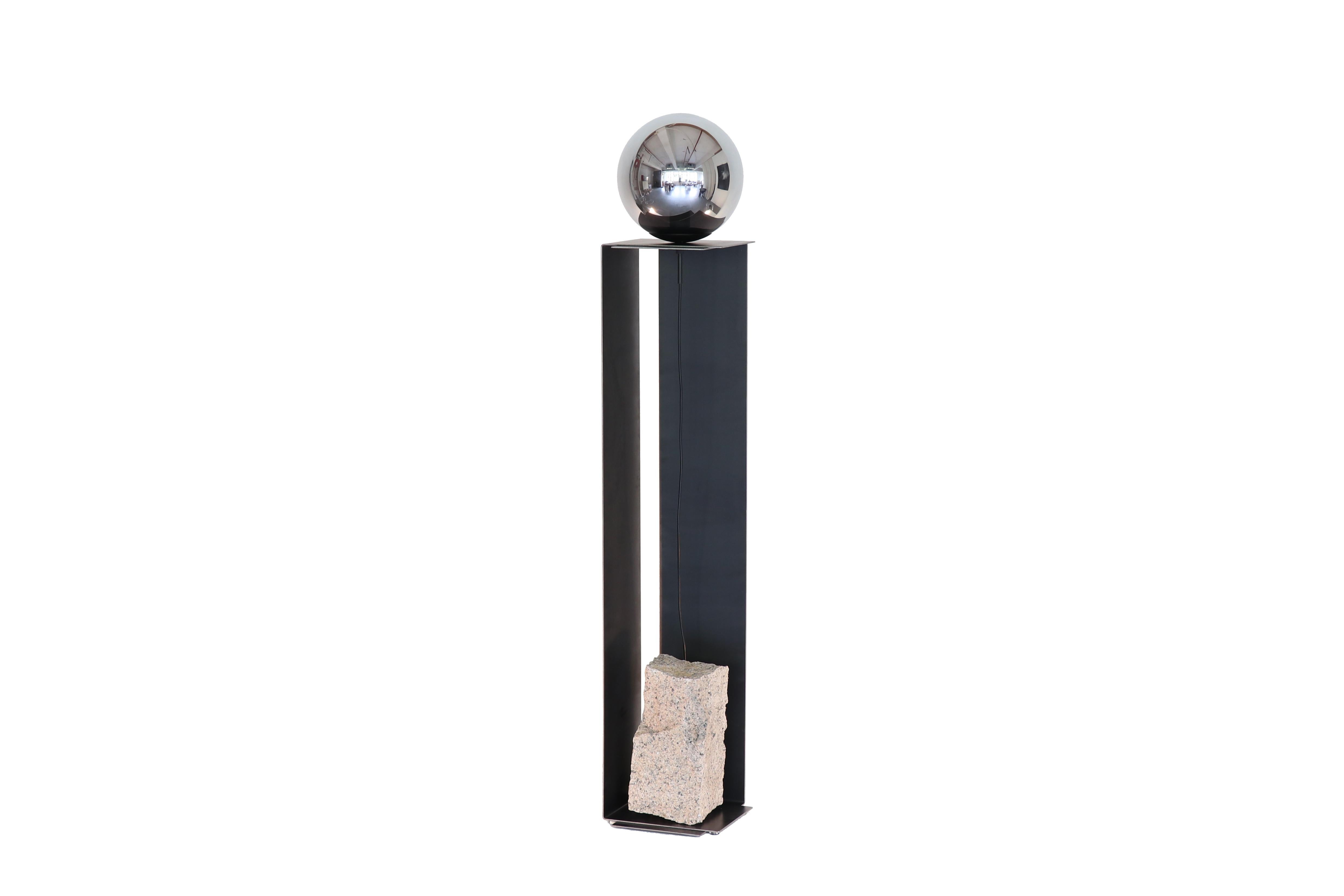 Steel and stone floor lamp by Batten and Kamp
Shelter to Ground collection
Dimensions: W 25 x D 25 x H 142 cm
Materials: Hand finished hot rolled steel, natural stone, tinted glass
LED, Electrical components

The stone is different with each