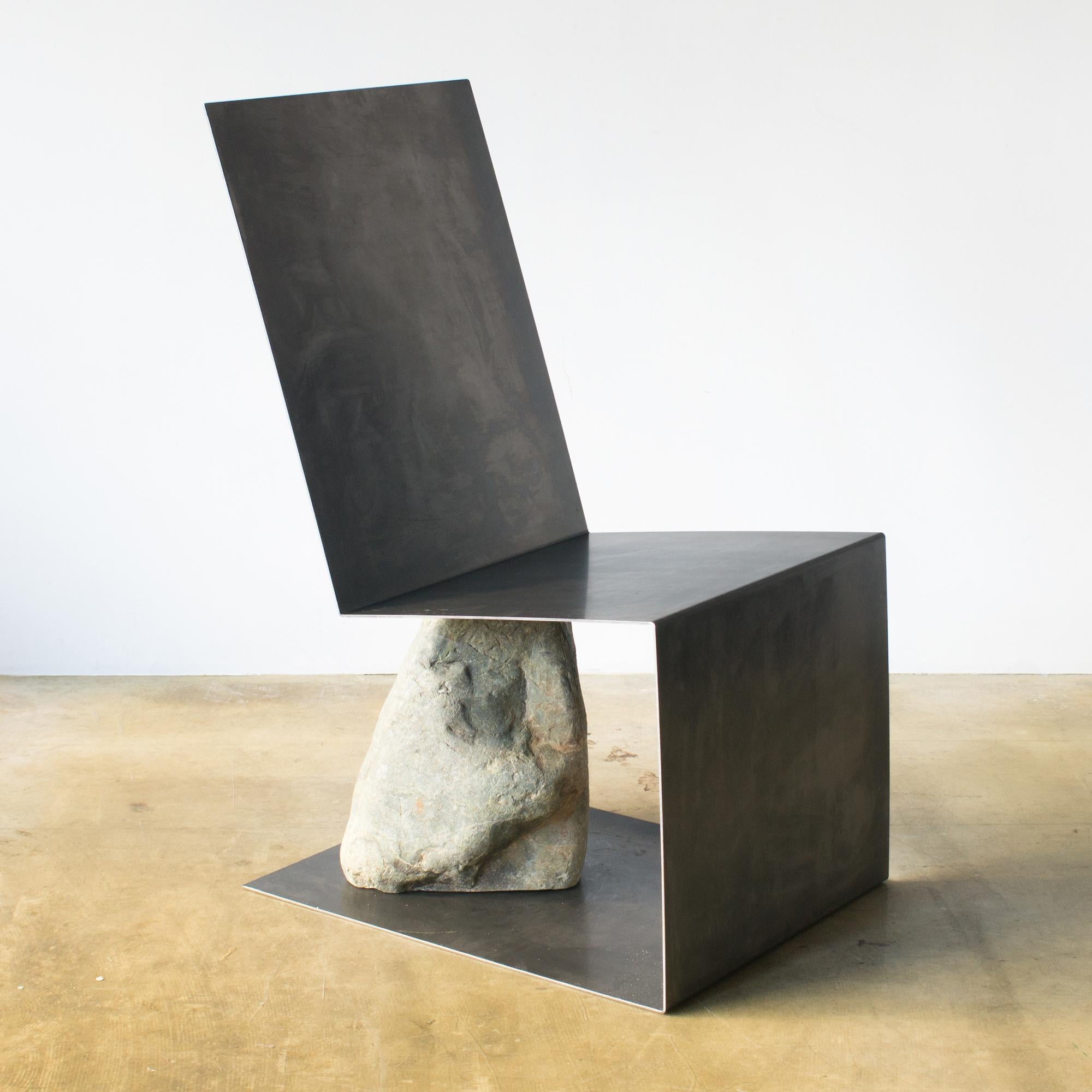 Chair designed by Batten and Kamp.
Minimal structure furniture made of steel and natural stone.
   