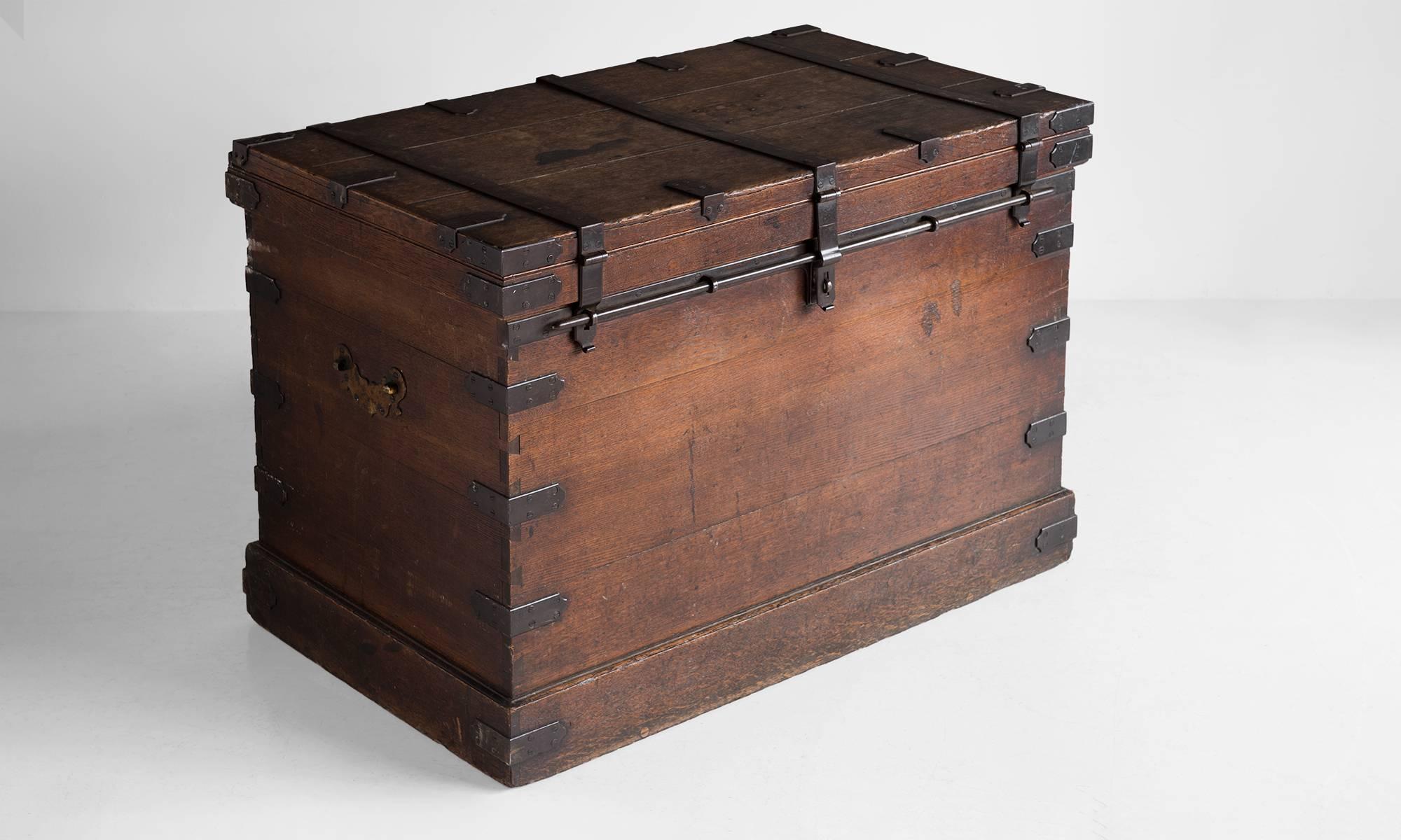 Steel bound oak chest, England, circa 1880.

Study oak chest with steel hardware and locking mechanism.