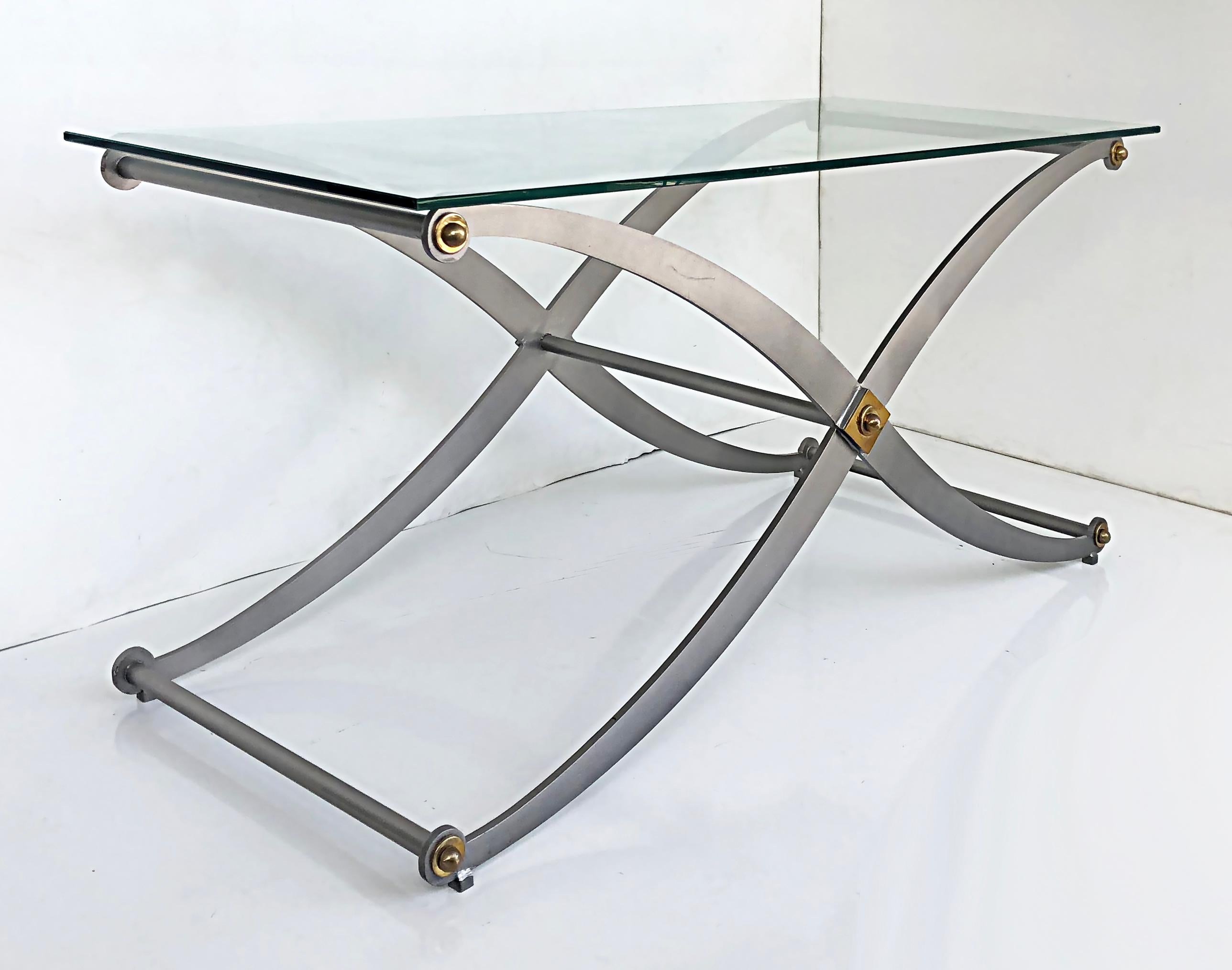 Steel / brass X-frame sabre leg console table with glass top.

Offered for sale is an elegant two-tone scrolled saber-leg x--frame console table that had just been fitted with a new thick glass top. This late 20th-century console table can float
